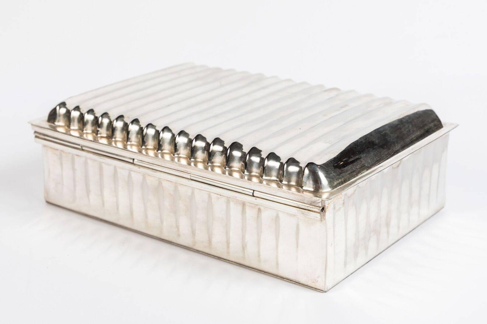 Elegant, hinge-top, silver-plated, Art Deco box with ribbed lid and body.