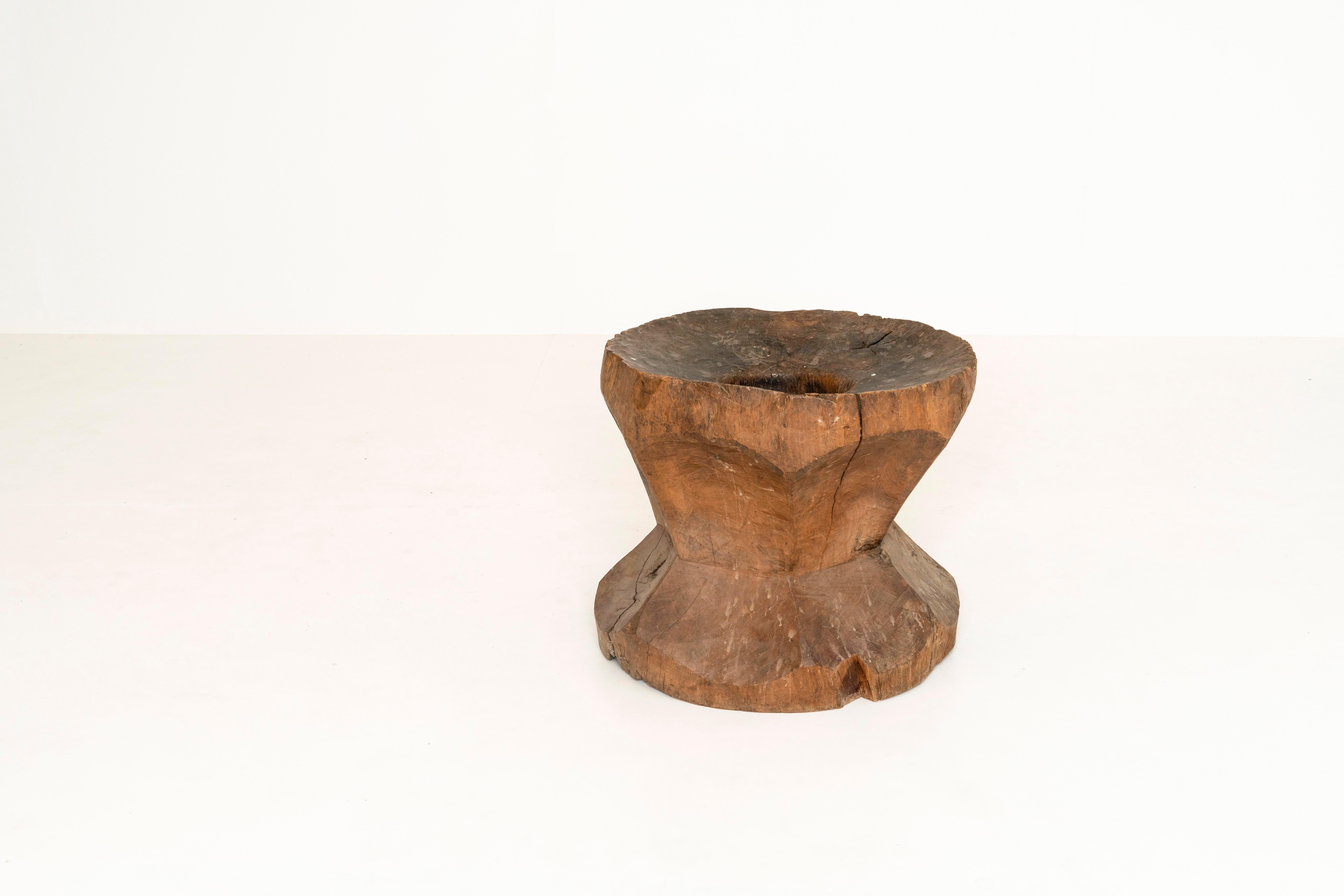 Decorative large antique mortar of wood. This robust item is great to add some warmth and texture to your interior. It can be used in combination with clothes or magazines. It is full of wear and tear; however, that is the beauty of this piece.