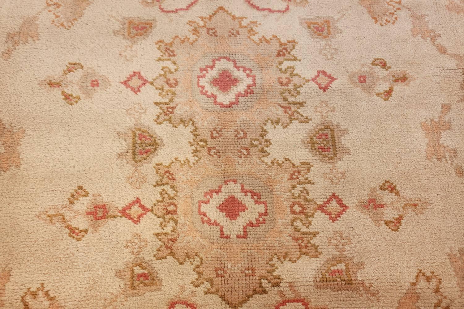 Beautiful and Soft Large Size Antique Turkish Oushak Rug, Country of Origin: Turkey, Circa Date: 1920. Size: 15 ft x 18 ft 6 in (4.57 m x 5.64 m)

Whimsical patterns and light, airy colors define this antique Oushak rug. The viewer is immediately