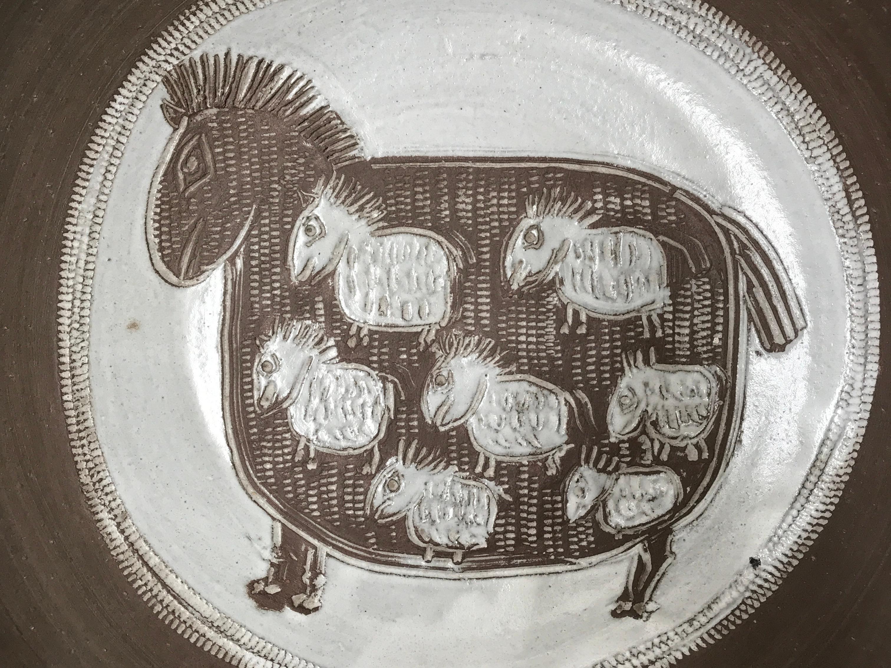 Important dish in chamotte clay, engobe decoration in soft intaglio.

This massive piece is signed on back and designed for wall mounting allowing you to fully enjoy its poetic decor.

Albert Thiry and his wife Pyot founded their workshop in