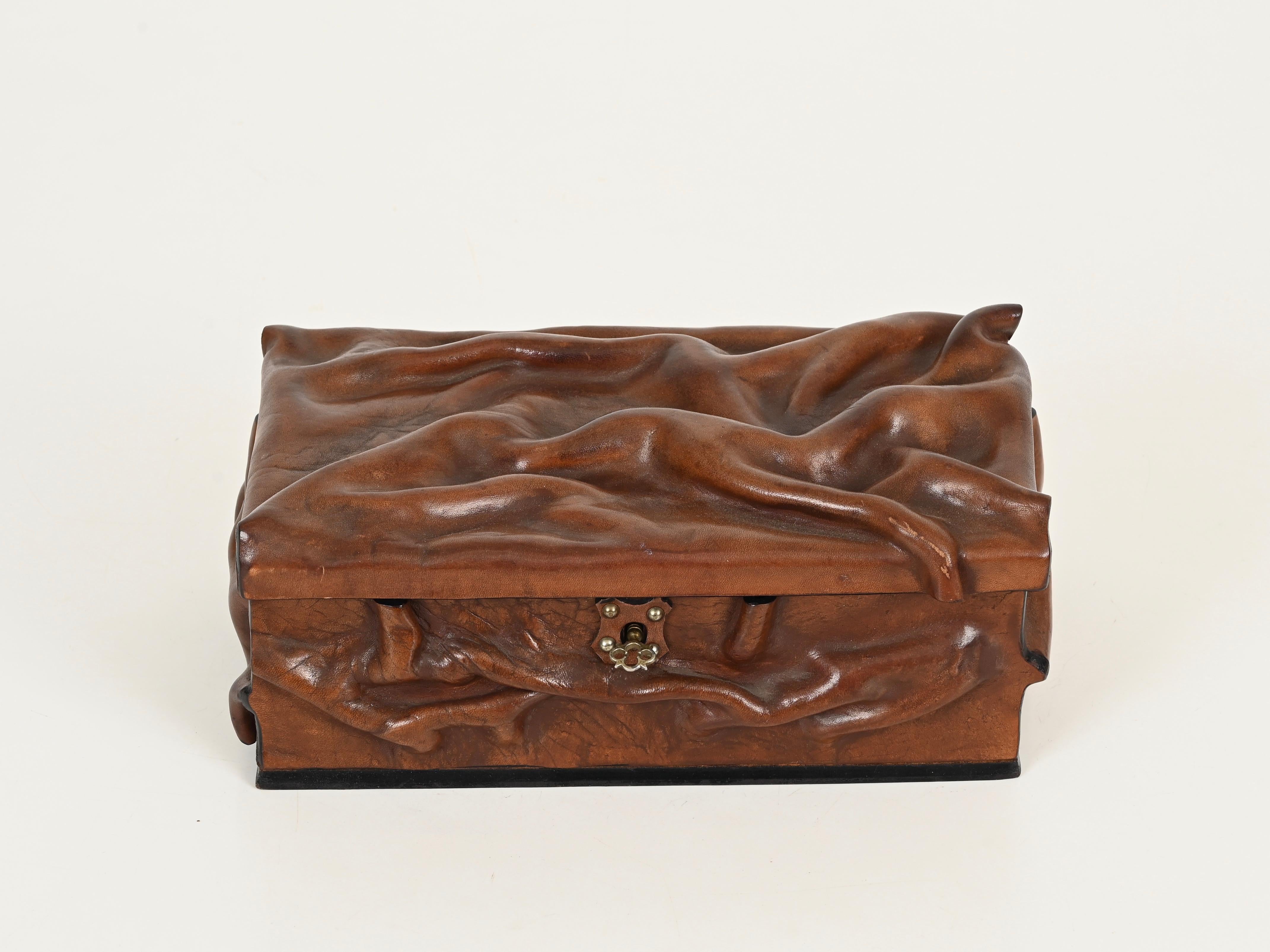 Marvelous large decorative box crafted in thick draped leather and brass. This incredibly elegant and unique piece was designed and handmade in Italy during the 1960s.

Fully original and in outstanding condition. The full-grain leather used for