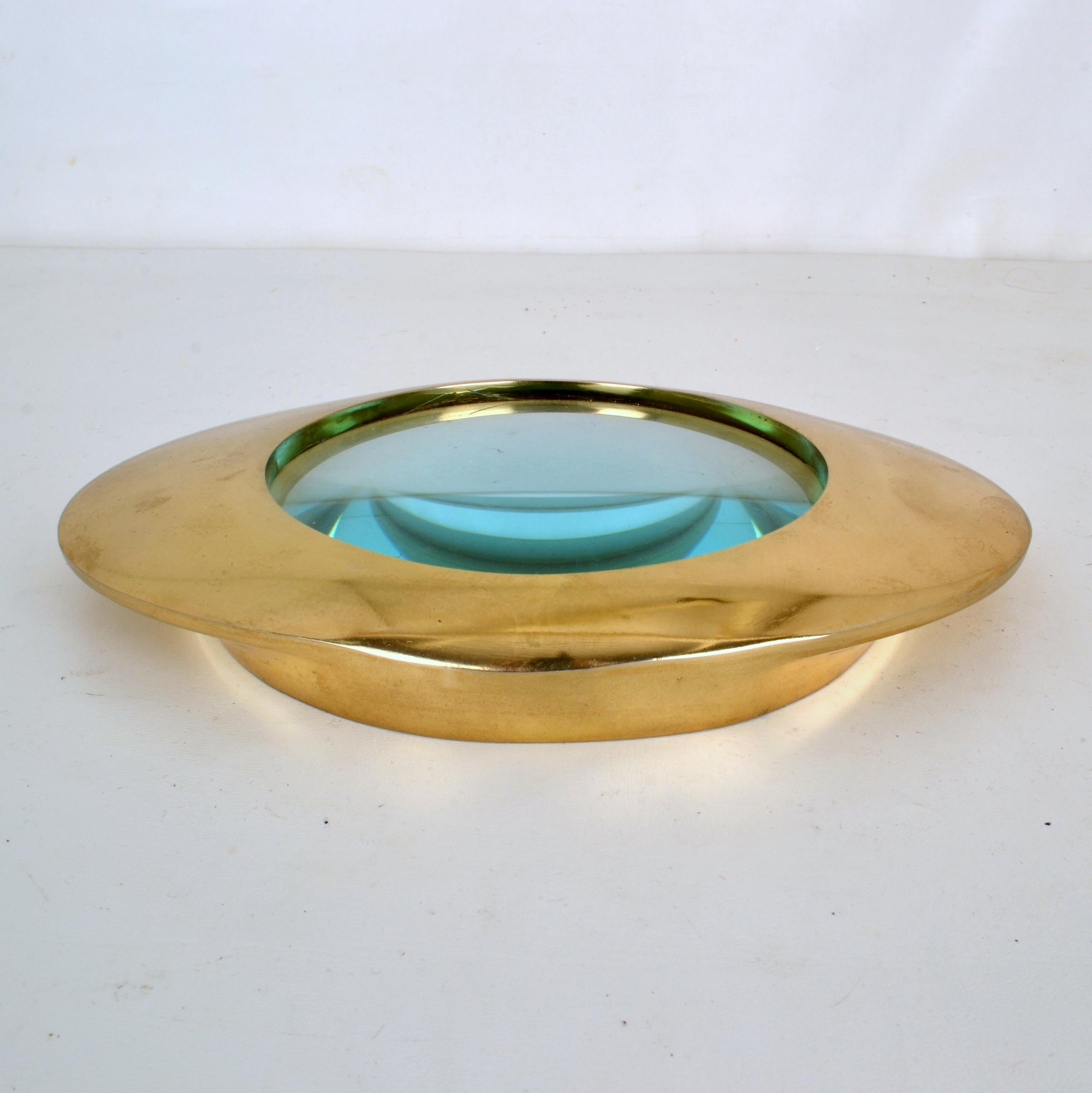 Large decorative magnifier lens with domed glass magnification, encased in eye shape brass cast frame. Very decorative piece that can also be displayed a s paper weight of desk accessorize. Inspired by Library magnifier lenses that were often used