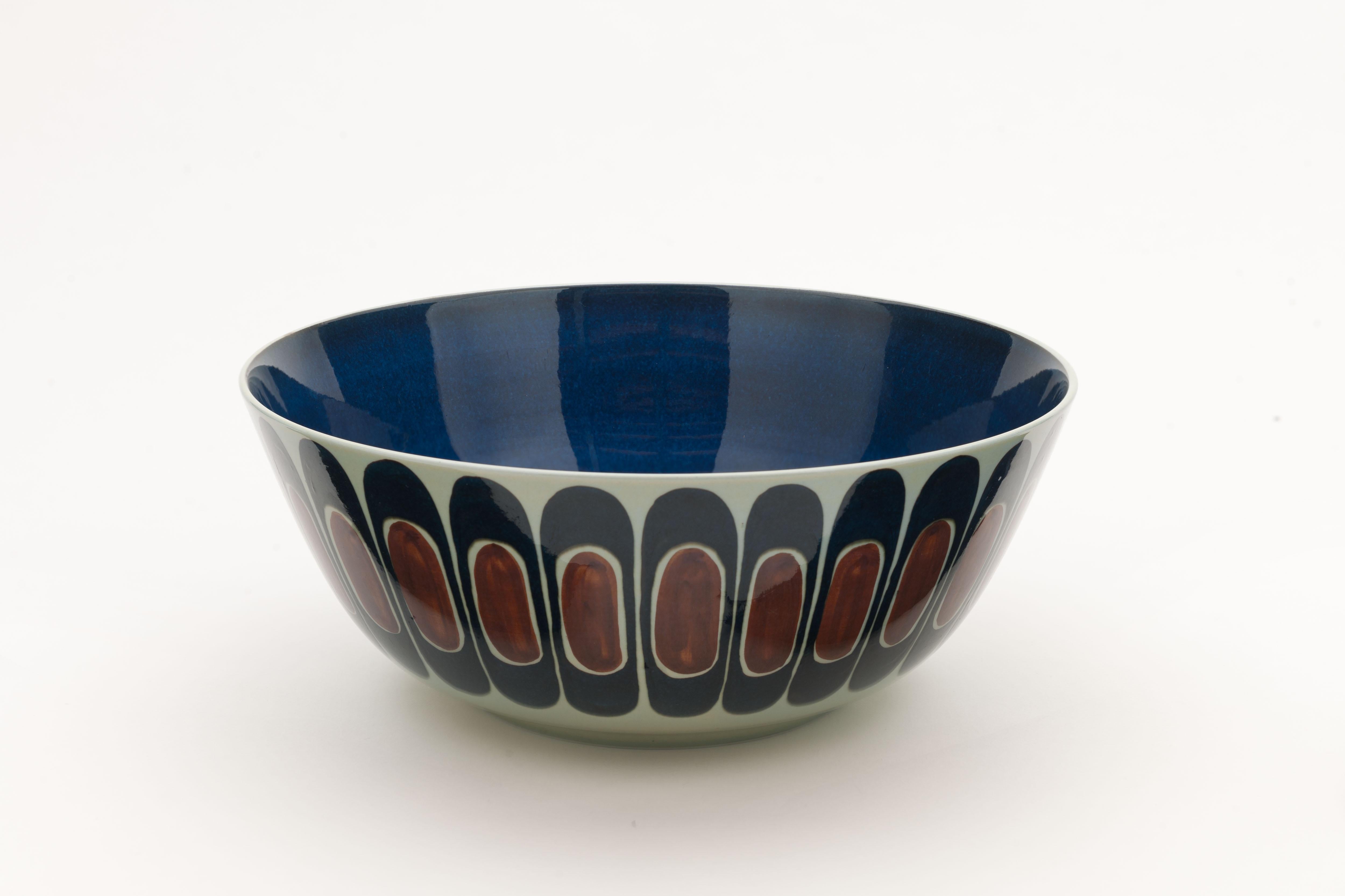 Beautiful large decorative glazed ceramic hand painted Fajance fruit bowl by Royal Copenhagen, Denmark, late 1960.
This decor was designed by designer 'Inge Lise Koefoed'. Inge-Lise was an artist at Royal Copenhagen's faience and stoneware