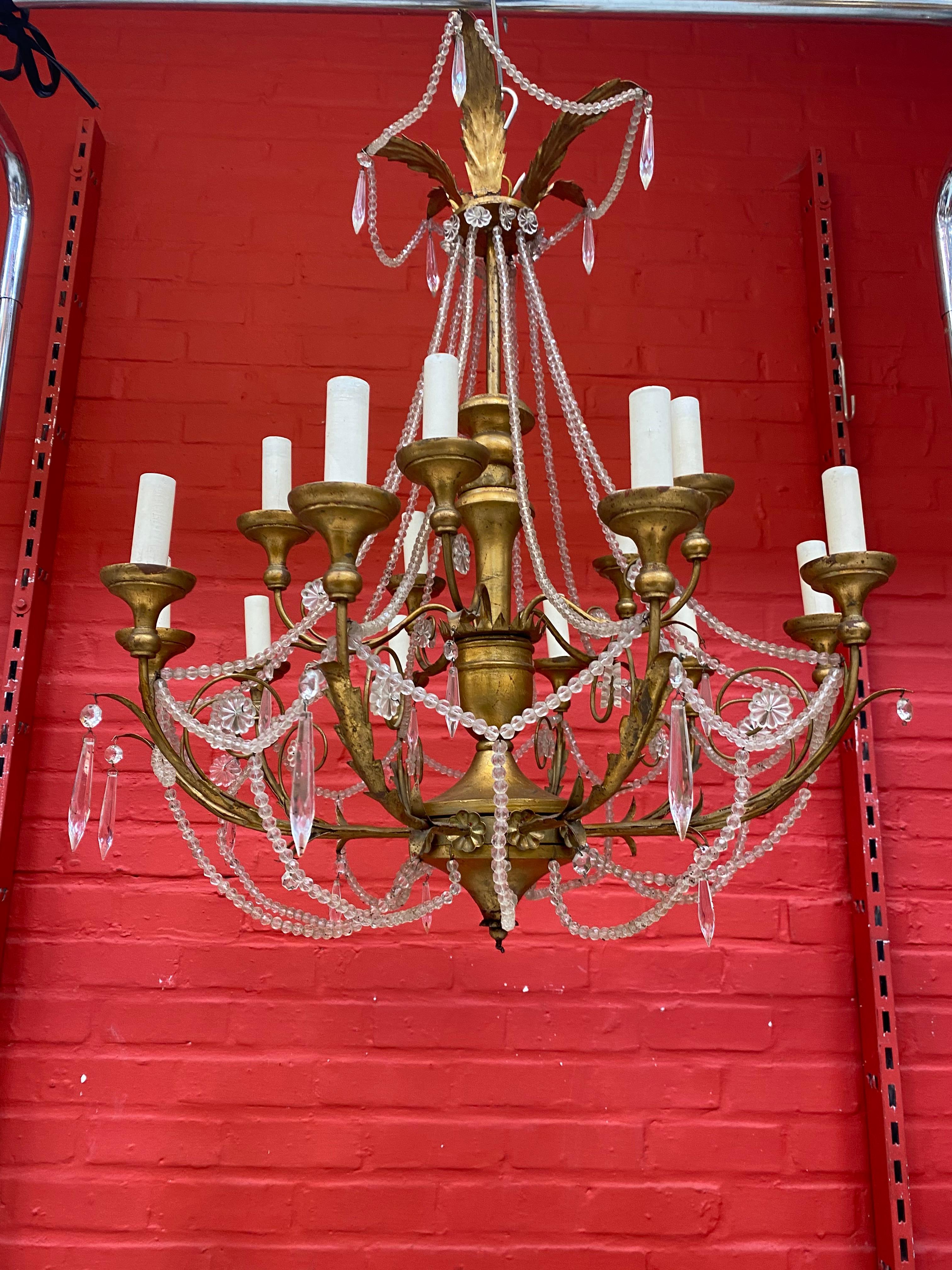 Large decorative chandelier in wood and wood and gilded iron, circa 1950.
  