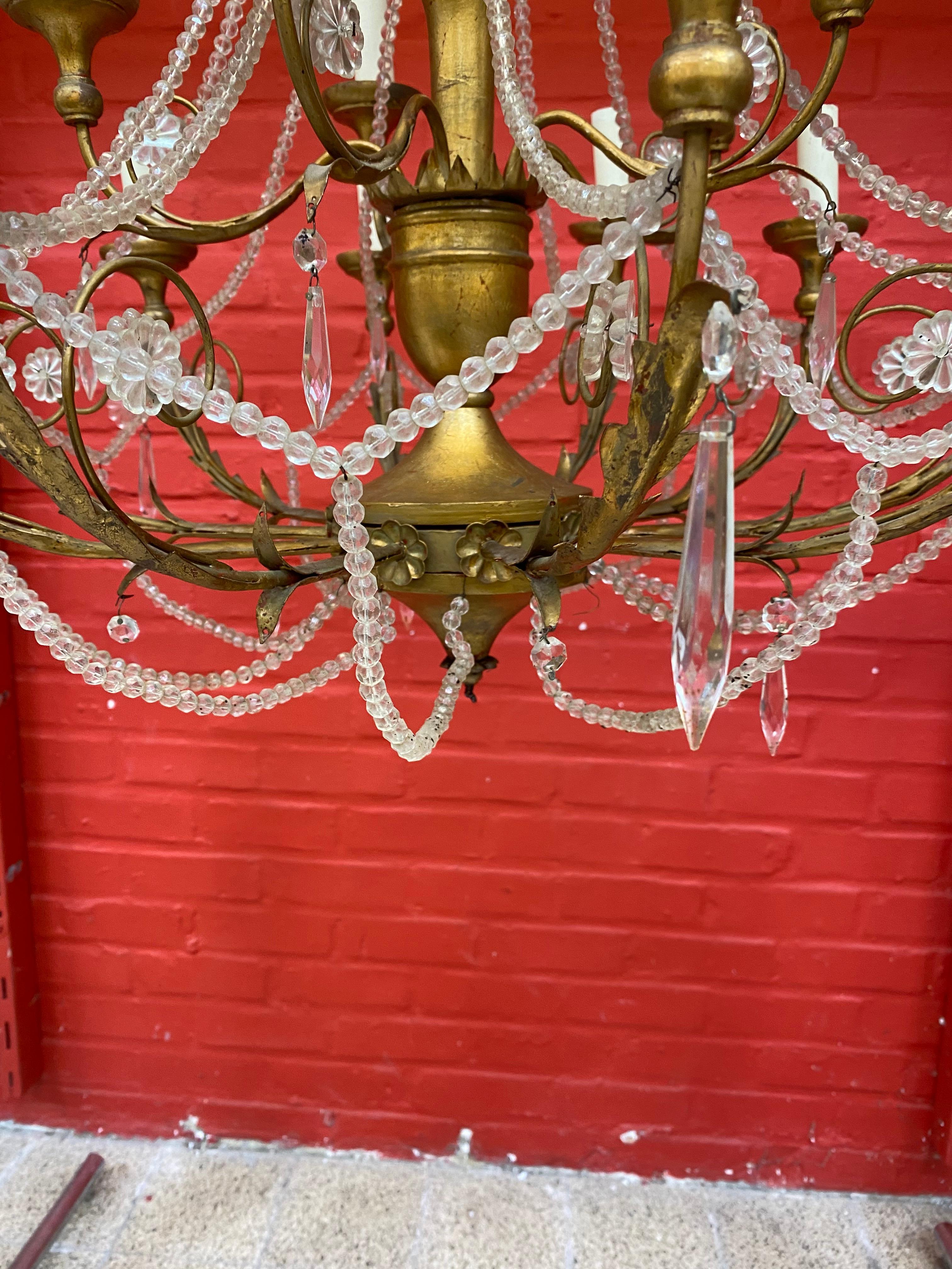 Wrought Iron Large Decorative Chandelier in Wood and Gilded Iron, circa 1950 For Sale
