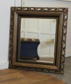 Large Decorative Dark Gilt Wall Mirror   This is a lovely old bevelled mirror