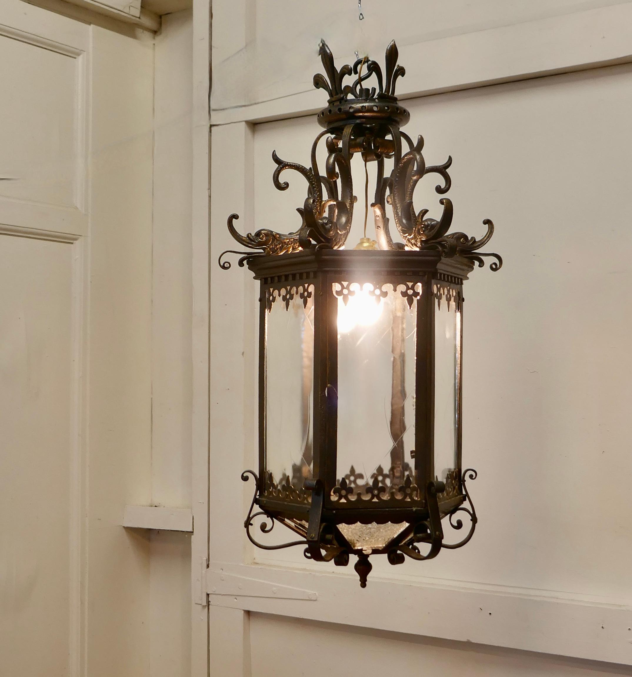 Large decorative French hall lantern

This is a very large Hallway or Porch Lantern it has 6 sides, at the top it is decorated with Fleur des Lys 
The is a large and chunky piece, inside we have a single lightbulb which can be altered inside the