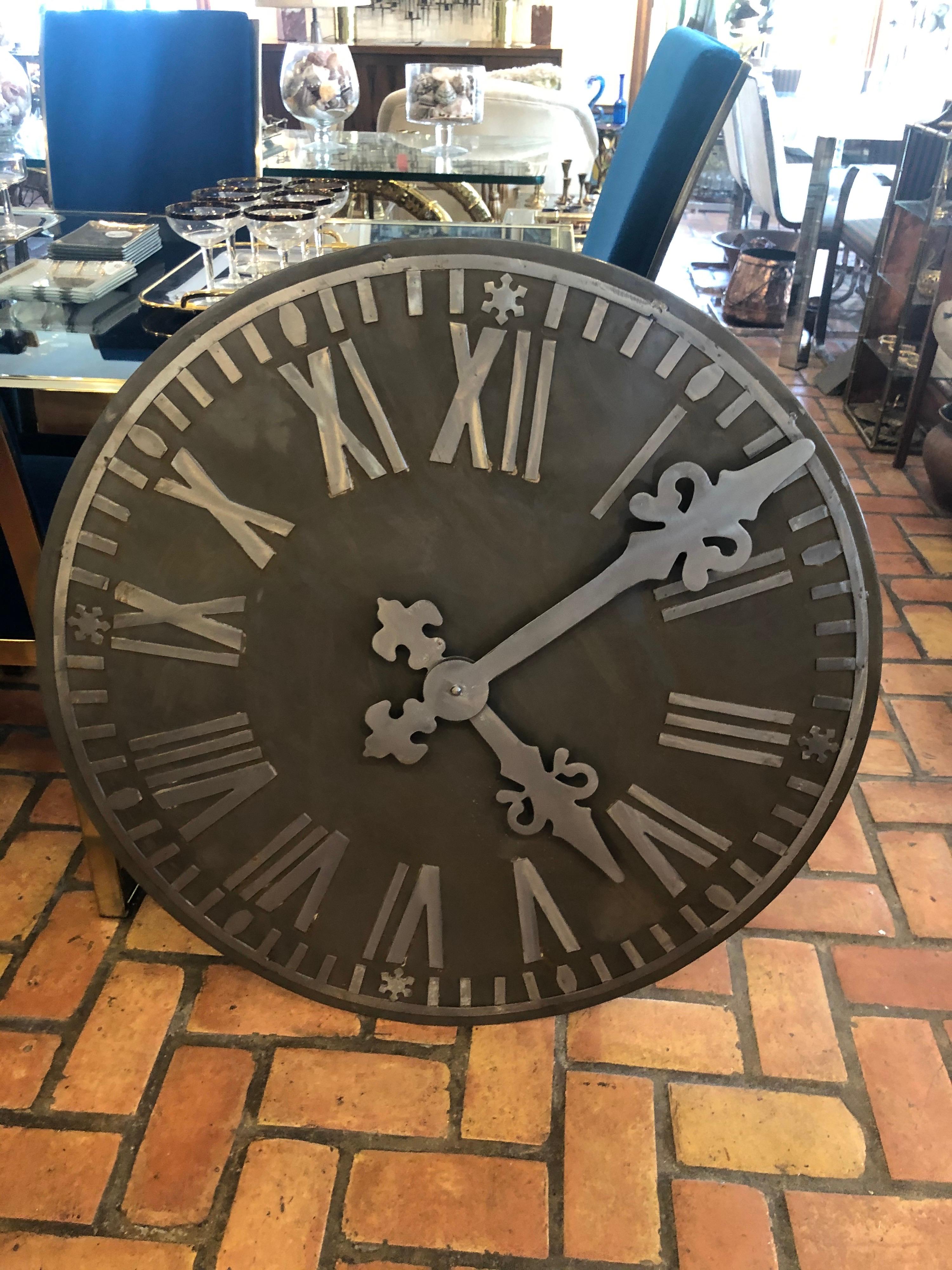Large decorative French style steel wall clock. Great focal point for any room. This item is merely decorative and does not tell time but could be wired to. Contrasting two-tone effect. Magnificent to look at. 35.50