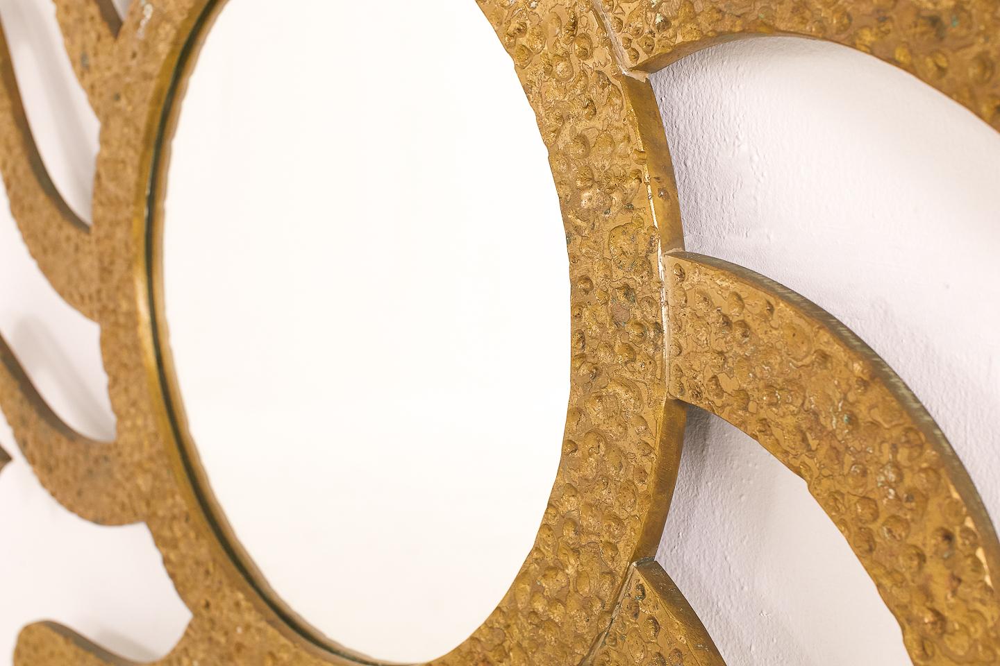 An exceptional quality, not lightweight, 1960s large gilded brass decorative mirror. Unusual model sunburst wall mirror.