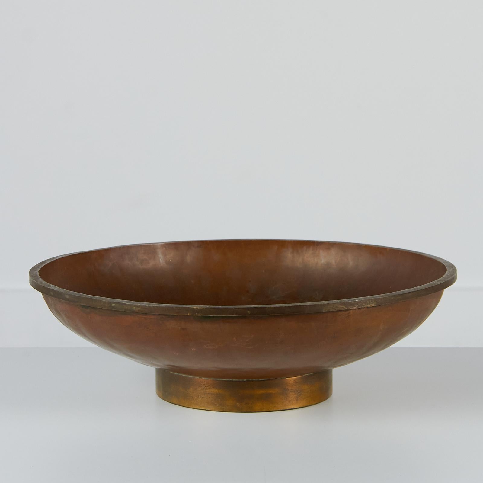 A large decorative copper bowl with a beautiful hammered detail throughout. This piece would be perfect on an entry way table to hold your trinkets or even in the kitchen to showcase your fruits and veggies. We personally see it on a large coffee