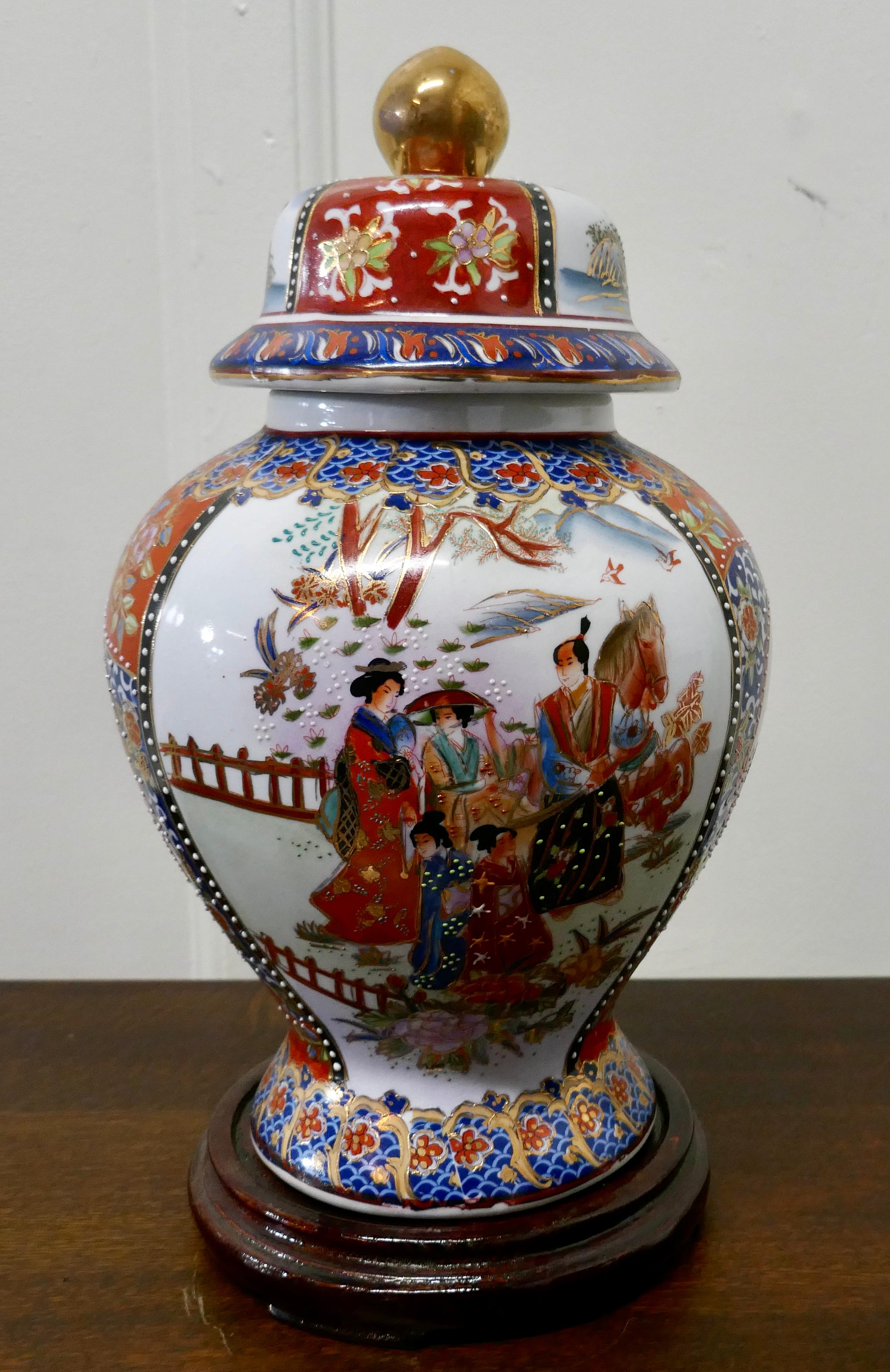 Large decorative oriental ginger or spice jar on stand

A delightful piece, tall, very bright with fine decorative detail
The vase is 16” tall, and 8” in diameter
GB272.
  