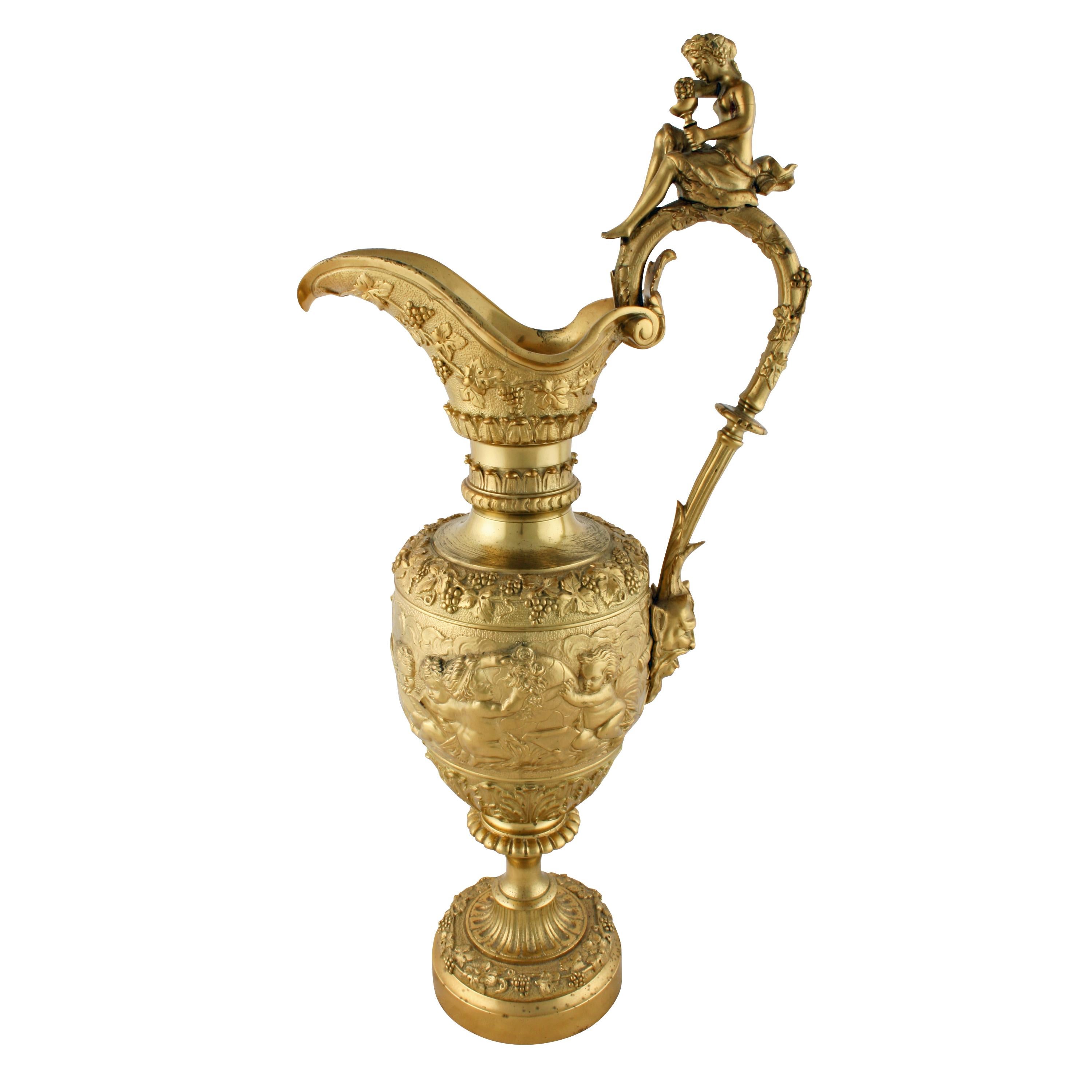 Large Decorative ormolu ewer

19th century large ormolu decorative ewer shaped ornament.


The Ewer is decorated with grapes and vines to the handle and the main body has cherubs at study.


The handle top is mounted with a female figure