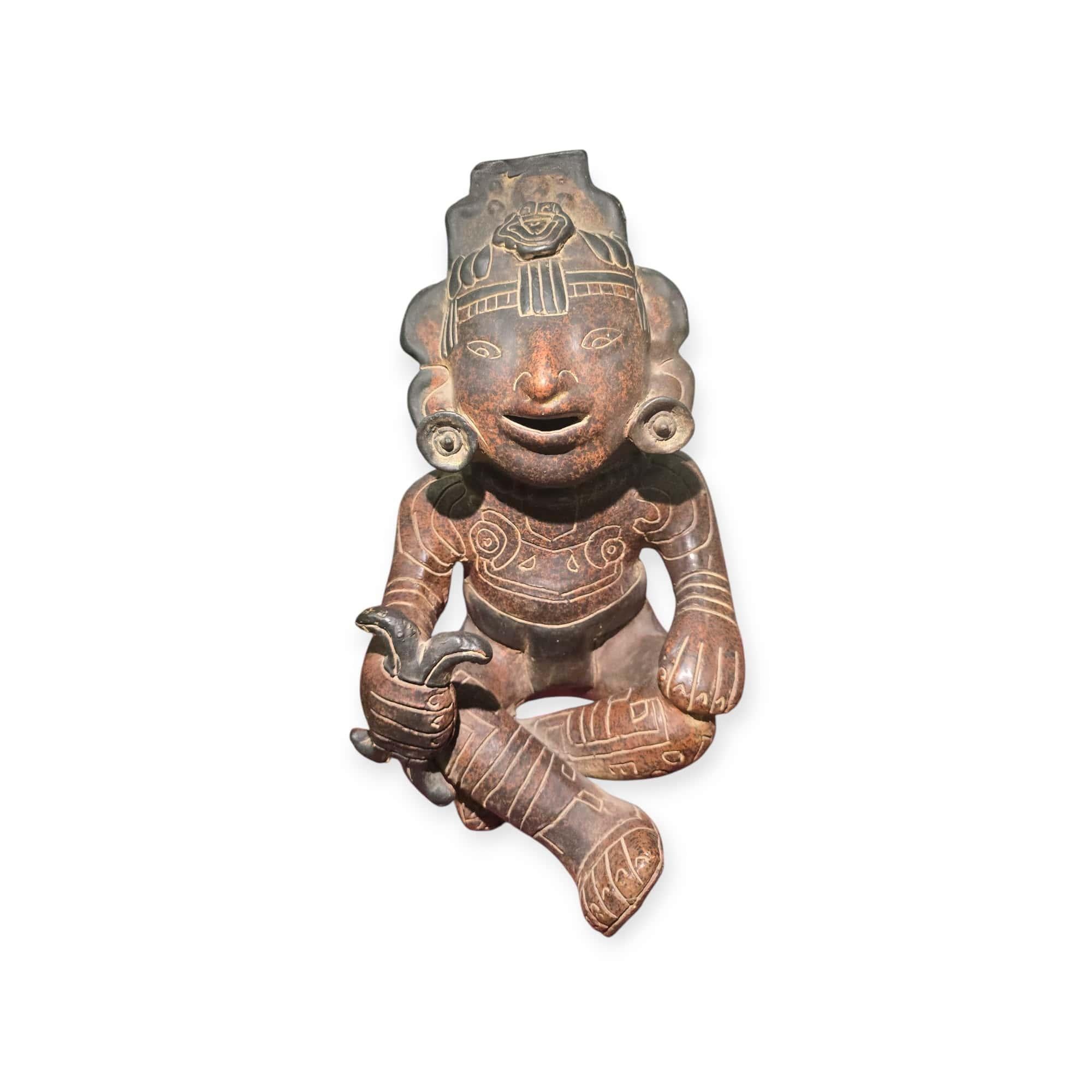 Impressive Pre-Columbian style figure from the 20th century, crafted in homage to ancient Mesoamerican art. The piece showcases stylized facial features and traditional ornamentation, capturing the aesthetic of pre-Hispanic cultures.

Period: 20th
