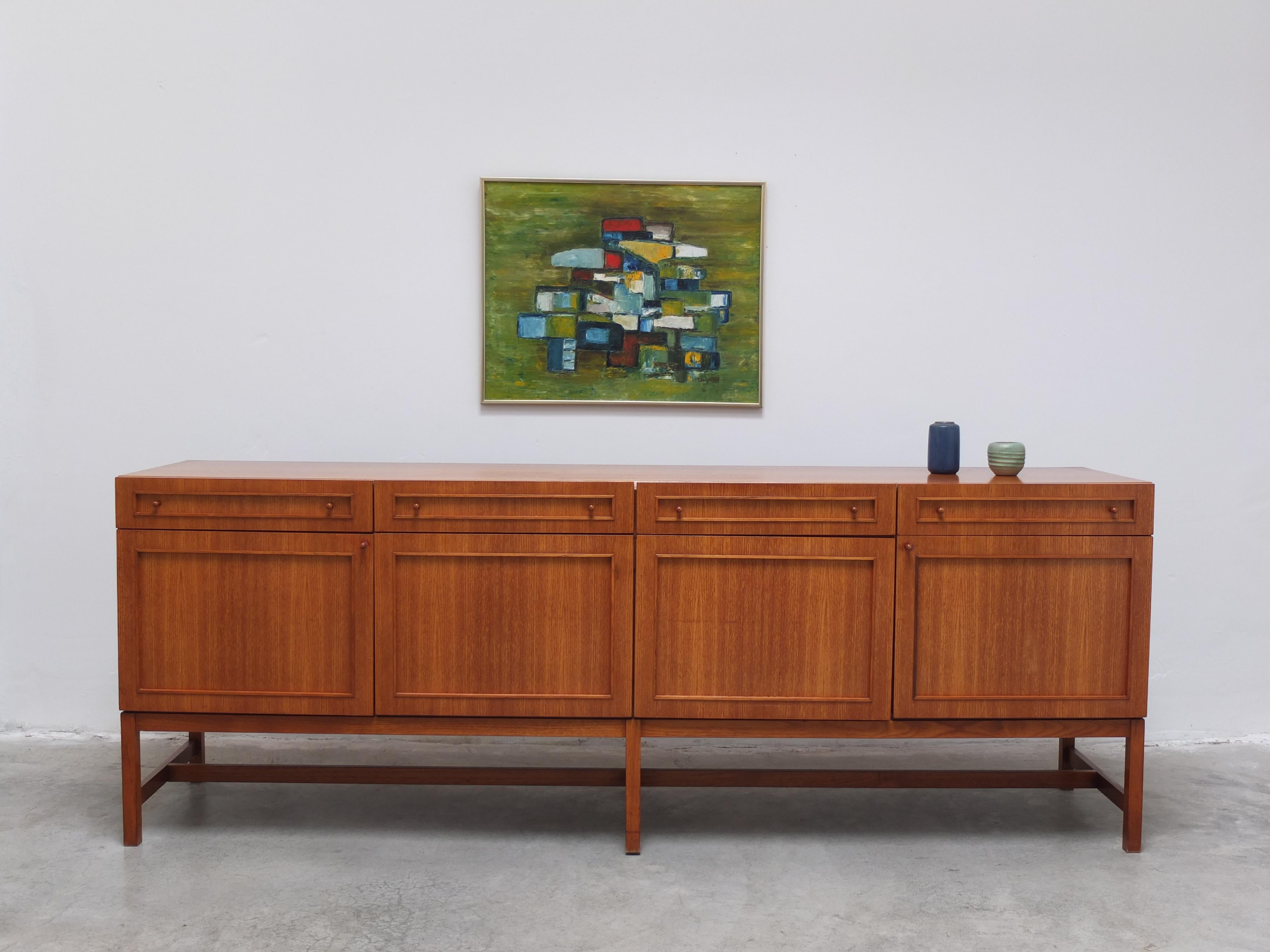 Exclusive sideboard produced by V-Form in Belgium around 1966 and most likely designed by Oswald Vermaercke. A very uncommon design in light teak wood with a nice decorative expression thanks to the geometric pattern of the doors and drawers in