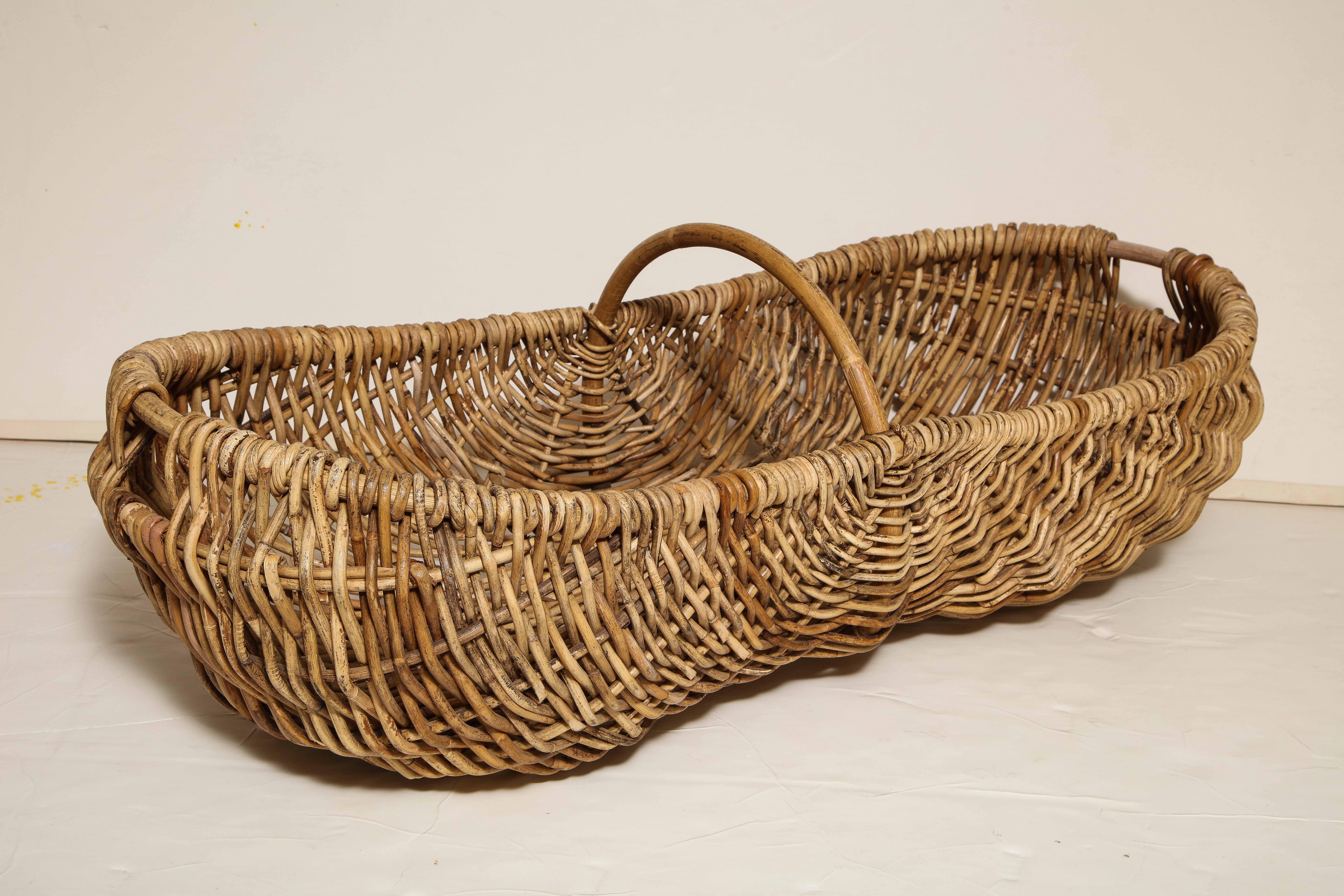 This sturdy basket from France features a long, deep container with a handle. Once used in the production of champagne, this great looking piece can now serve as a container for logs, linens, magazines, anything!