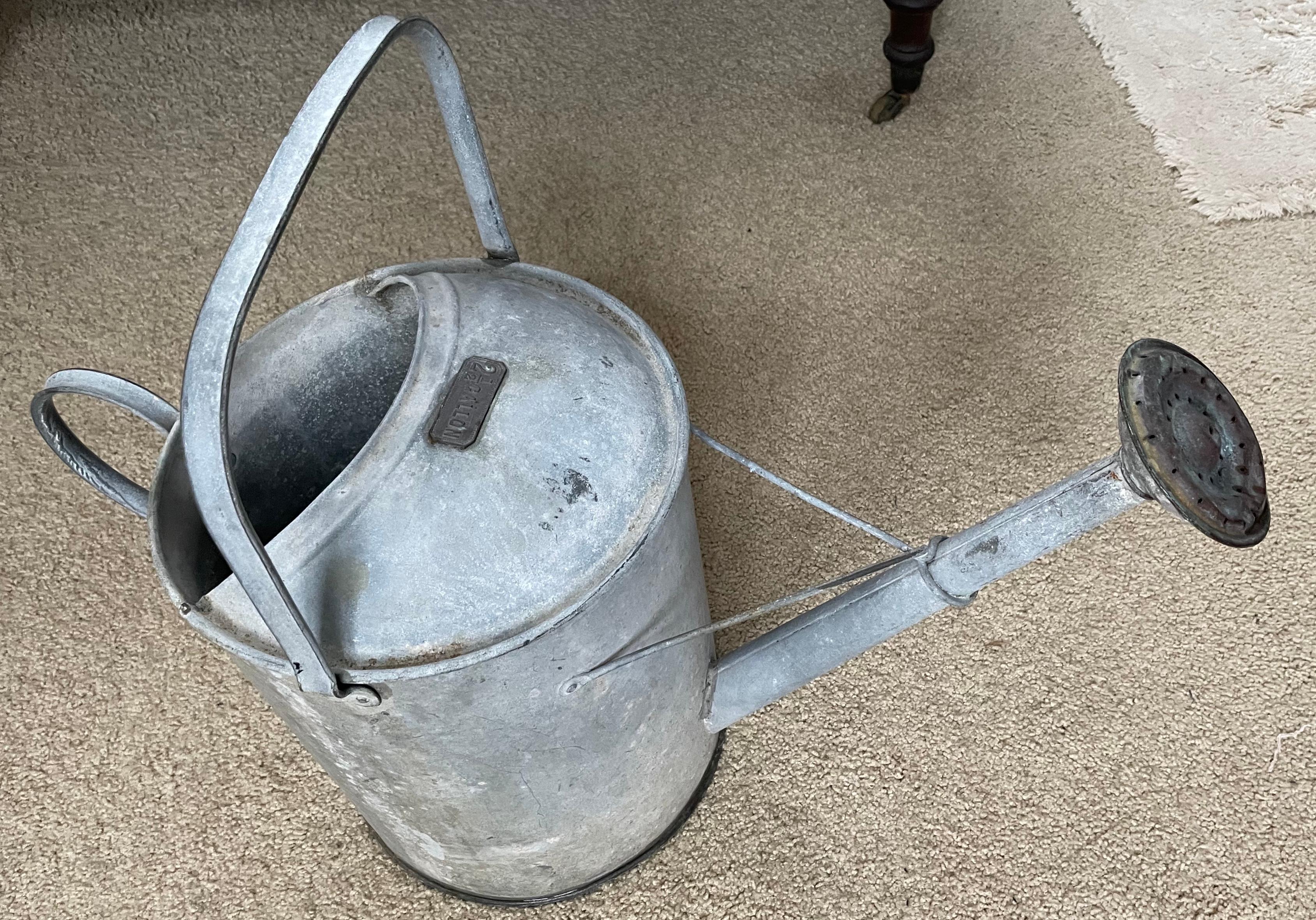 Zinc watering can. Large decorative vintage American 2.5 gallon watering can to be filled with overflowing spring snd summer blooms or for watering tasks. Perfectly functional can for larger watering chores in the garden with pinhole leak somewhere