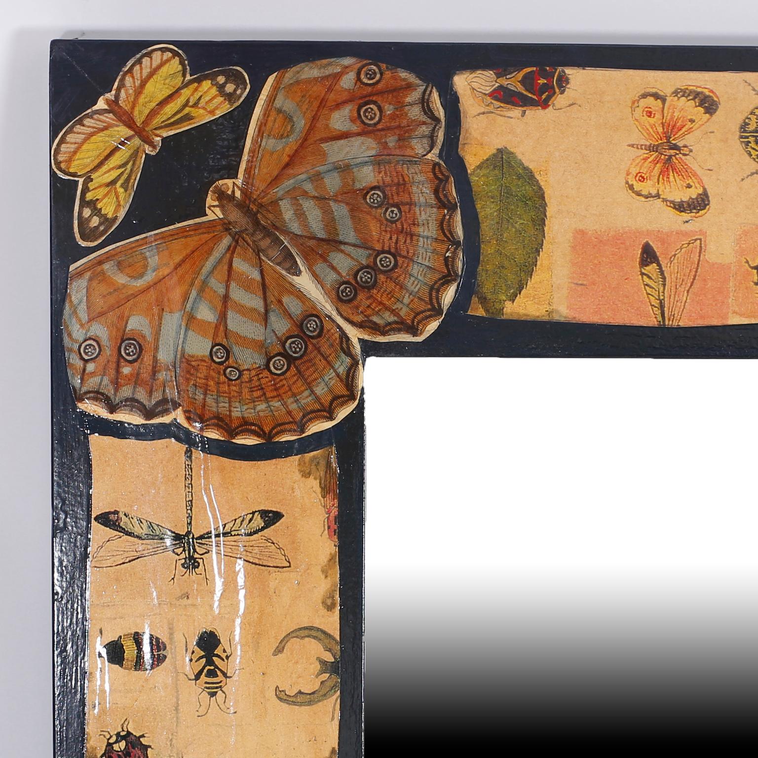 Square mirror with an enchanting découpaged frame decorated with butterflies, dragonflies, bugs, and an assortment of insects.