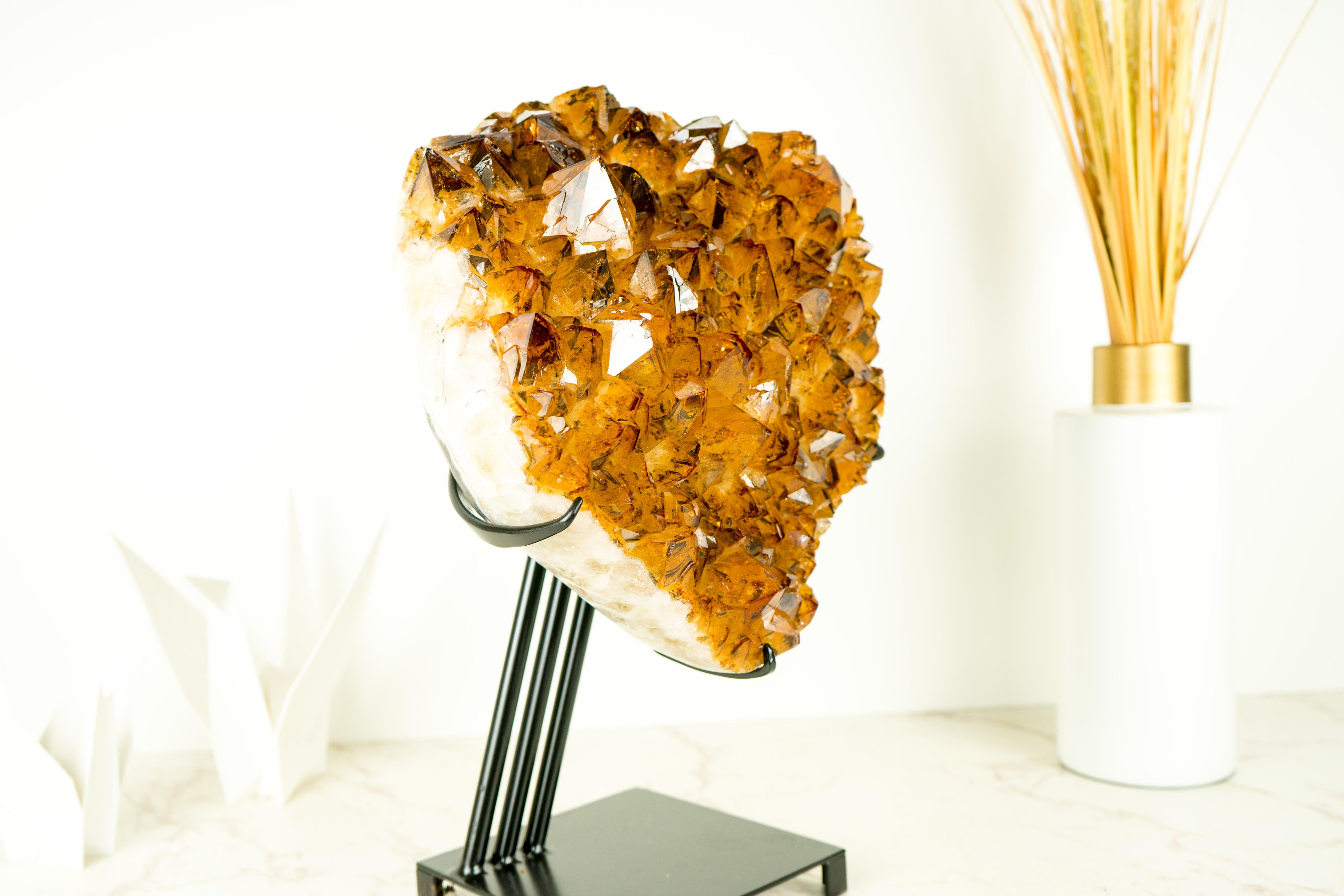 A remarkable large citrine cluster, this rare citrine specimen combines unique characteristics to form a world-class piece. Its deep, rich orange tone epitomizes beauty and elegance, complementing the trapiche formation to create a standout feature