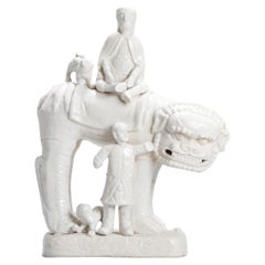 Large Dehua Blanc de Chine European Figure and Lion Kangxi Period, 17th Century