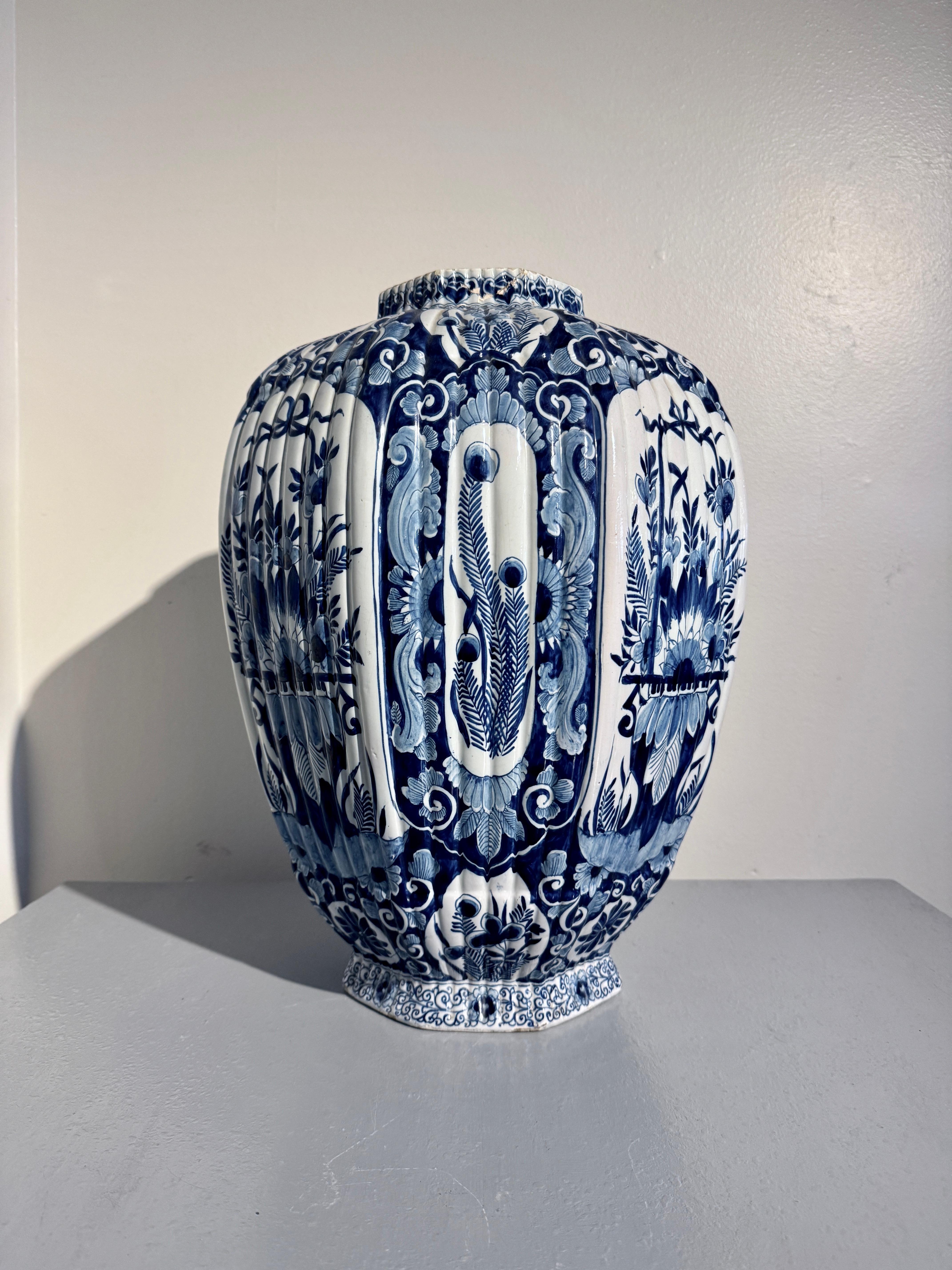 A large and impressive Dutch Delft jar of octagonal shape with fluted sides, mark for Johannes Van Duijn, De Porceleyne Schotel Factory, 1764 - 1773, Delft, Holland, the Netherlands.

The tall earthenware jar or vase of octagonal ovoid form, the