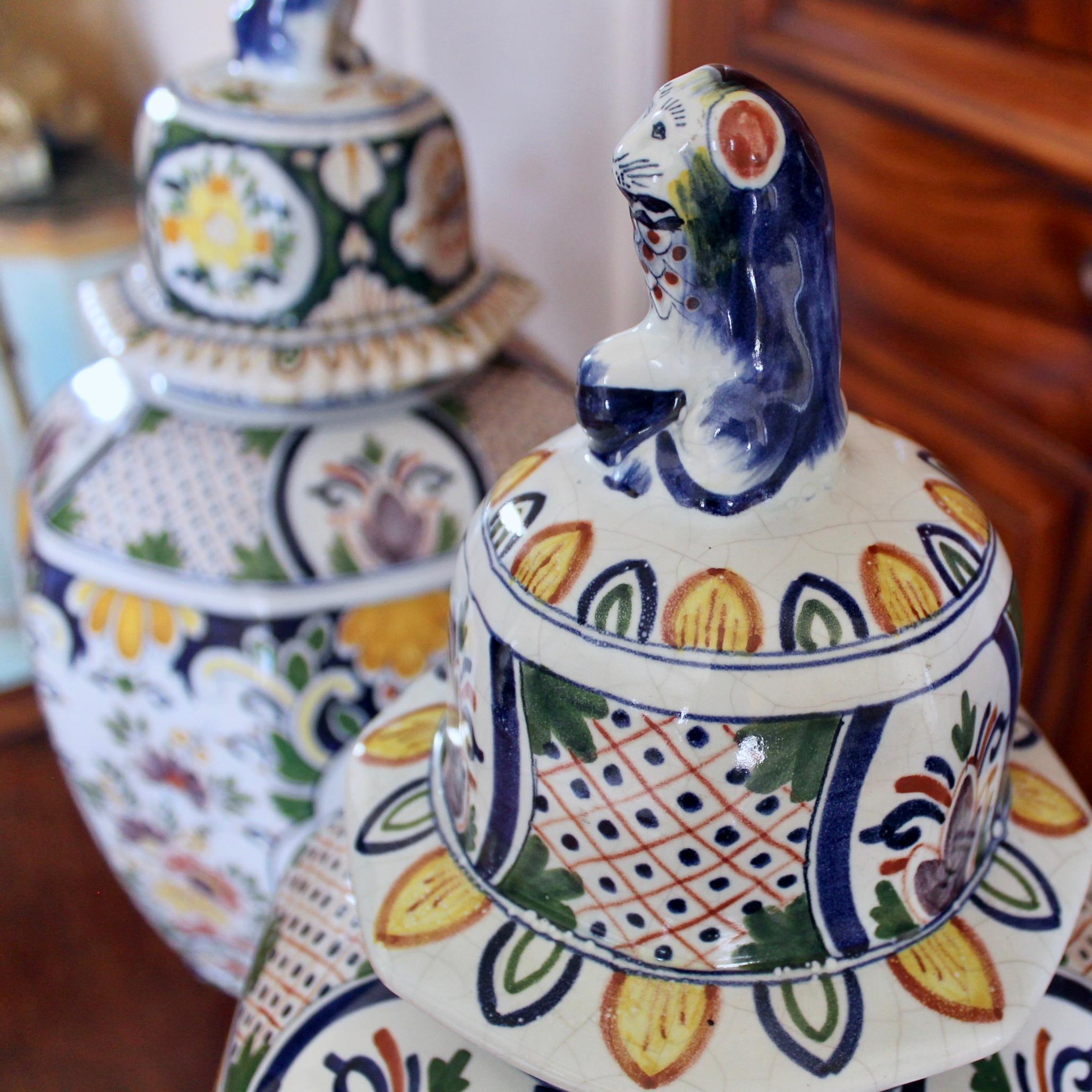 Glazed Large Delftware Polychrome Covered Jars With Lion Finials- a Pair For Sale