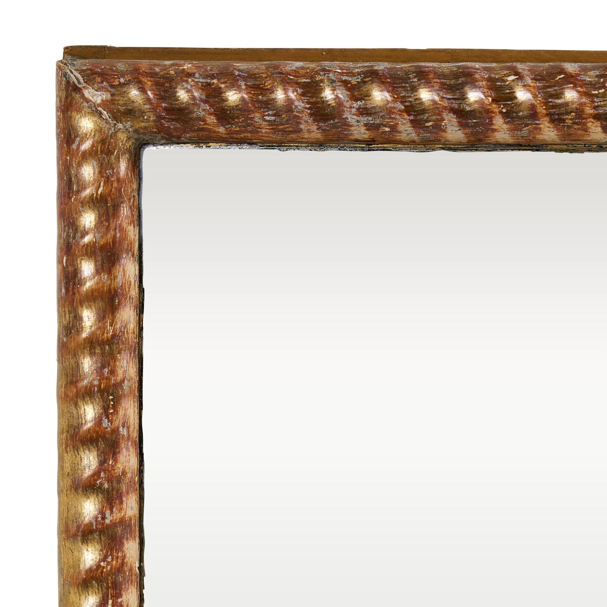 This beautiful 19th-century mirror was discovered in France. Exceedingly simple and extremely refined, it has a delicate, hand-carved rope frame with its original gilded finish. Perfect for an entry hall.