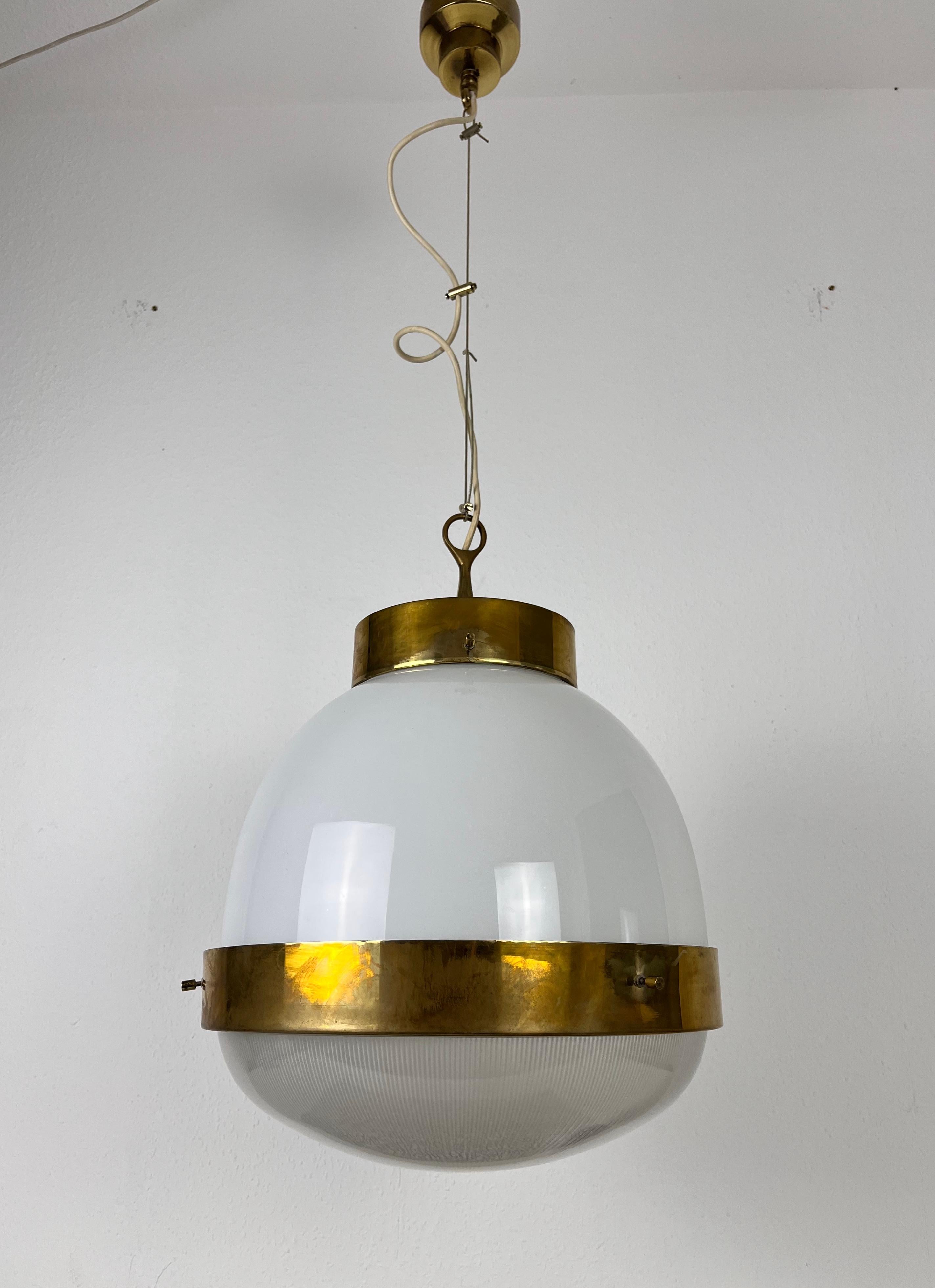 Delta chandelier by Sergio Mazza for Artemide made in Italy in the 1960s. It is fascinating with its glass shape and wonderful brass elements.

Dimensions
Height: 40-105 cm
Diameter: 35 cm

The light requires one E27 (US E26) light bulb in the