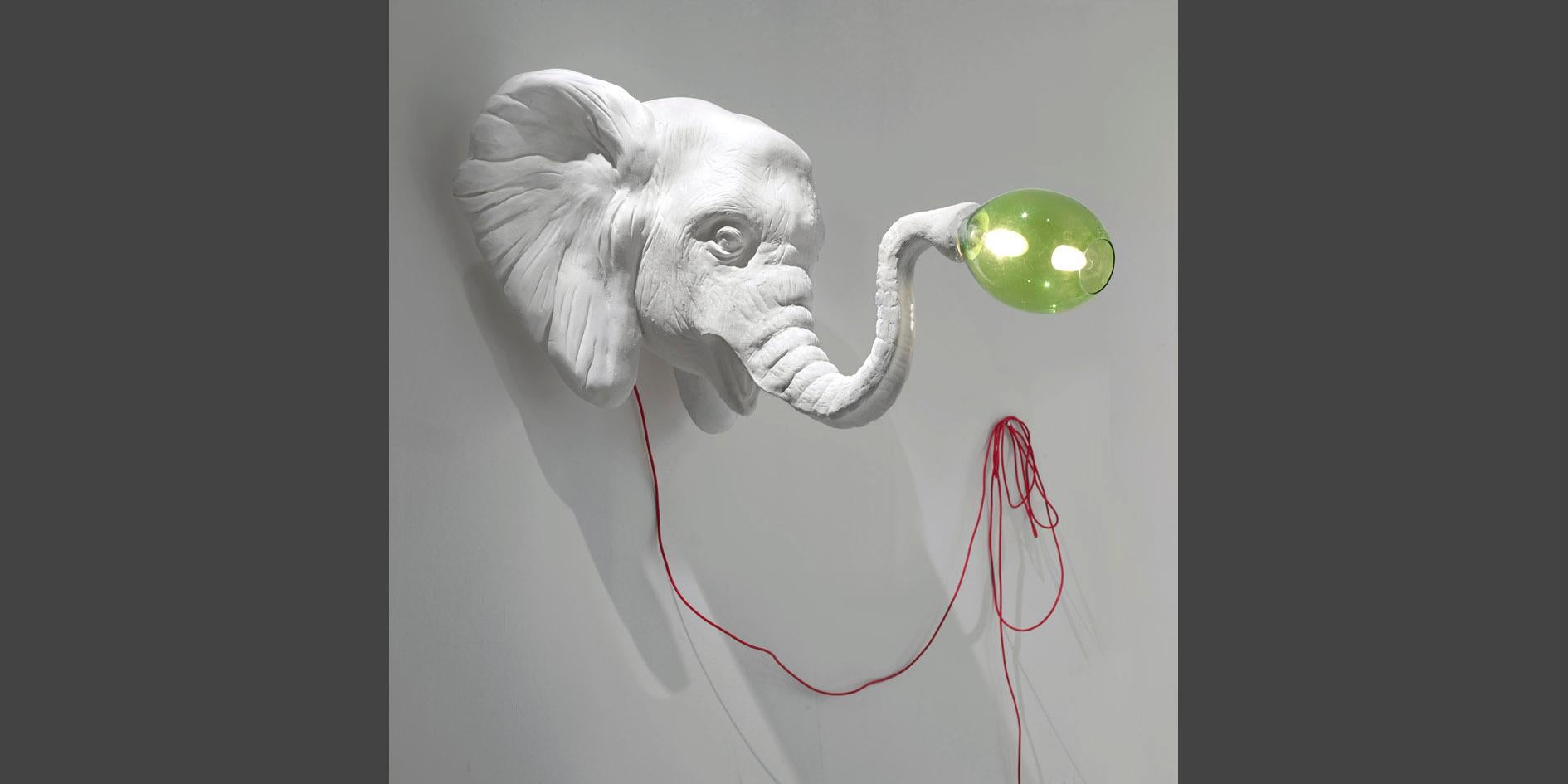 A large wall-mounted sculpture representing an elephant ready to light your way!
