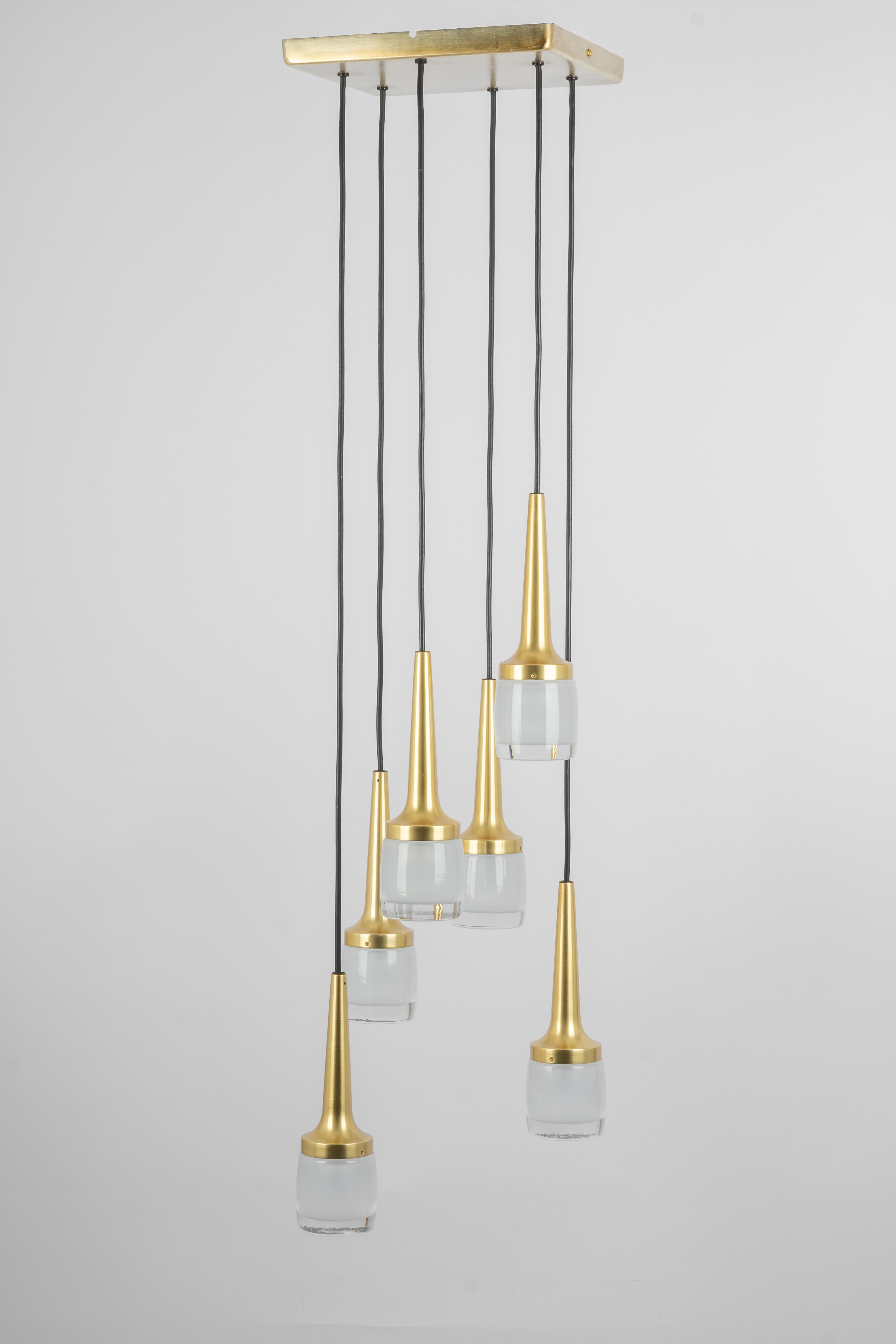 A special large cascading chandelier designed by Staff Leuchten, manufactured in Germany, circa the 1970s with 6 glasses.
Wonderful form and stunning light effect.
Sockets: 6 x E14 small bulbs. (40 W max for each bulb).
Light bulbs are not