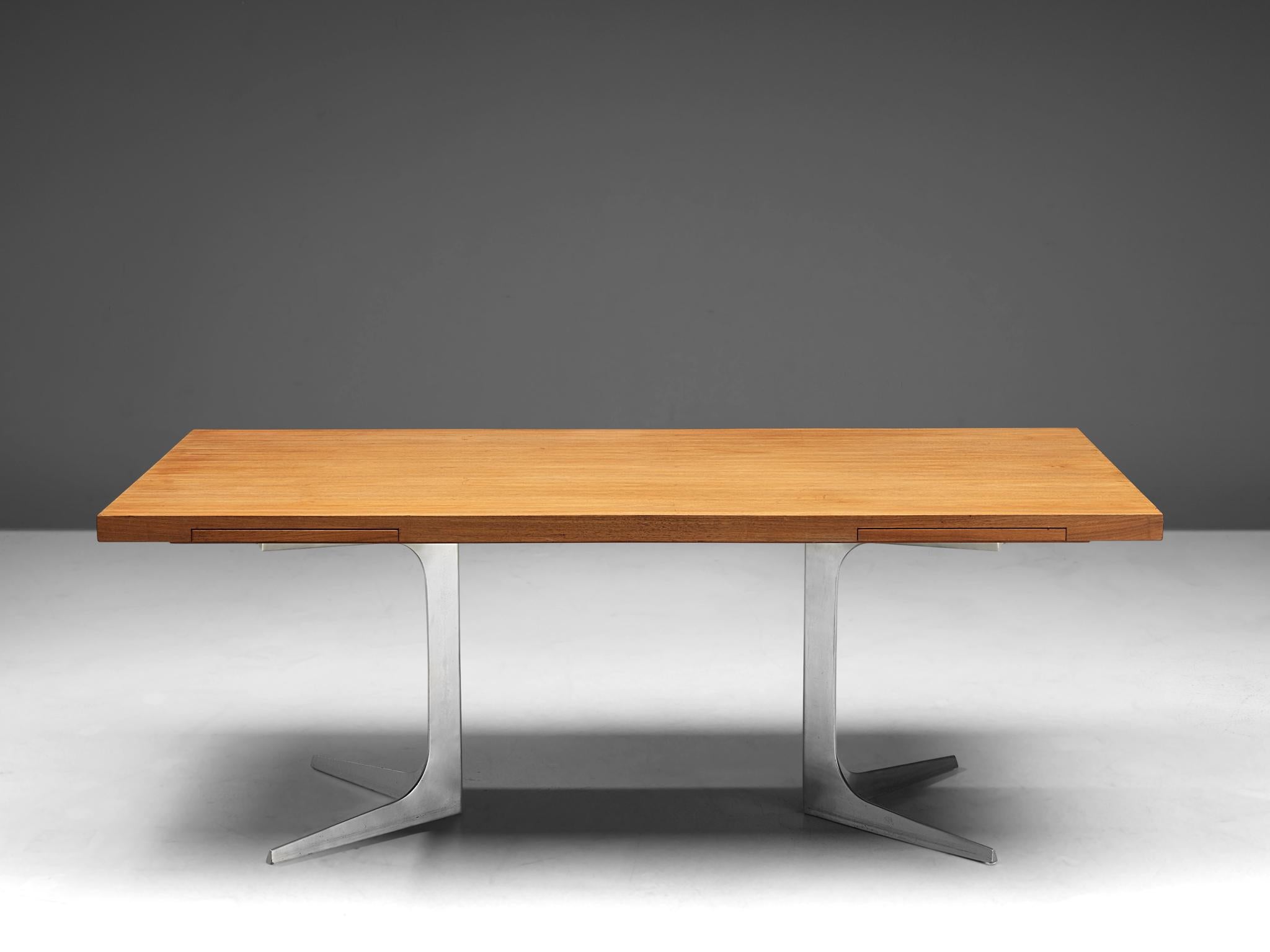 Desk designed by Herbert Hirche, manufactured by Christian Holza¨pfel, teak and cast aluminium, Germany, 1960s. 

This desk, designed by Herbert Hirche, consists of an organically shaped frame made out of moulded cast aluminium, with a teak wooden