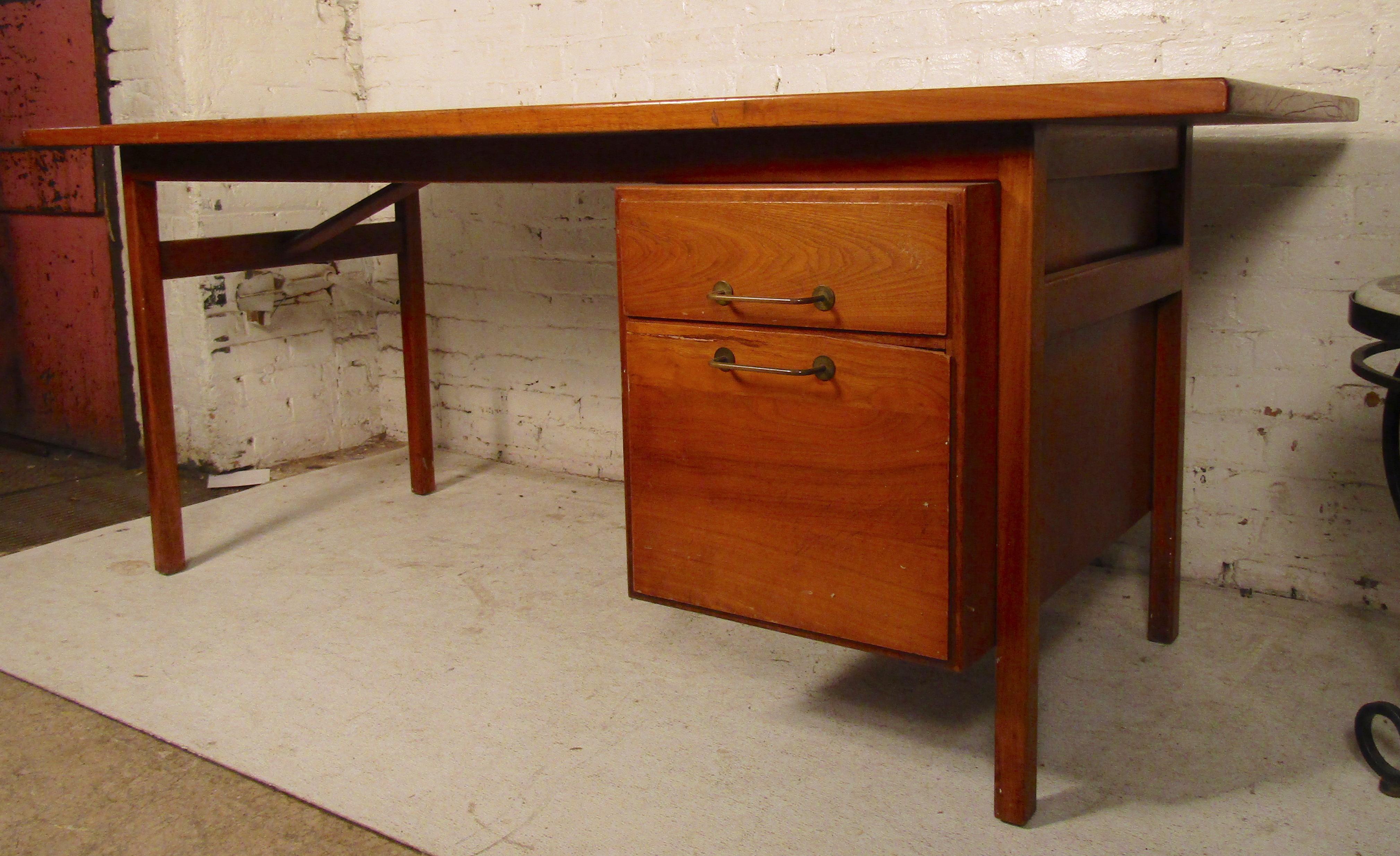 Oversized walnut desk with curved top designed by Jens Risom. Finished cabinet back for use anywhere in the room.
(Please confirm item location - NY or NJ - with dealer).
  