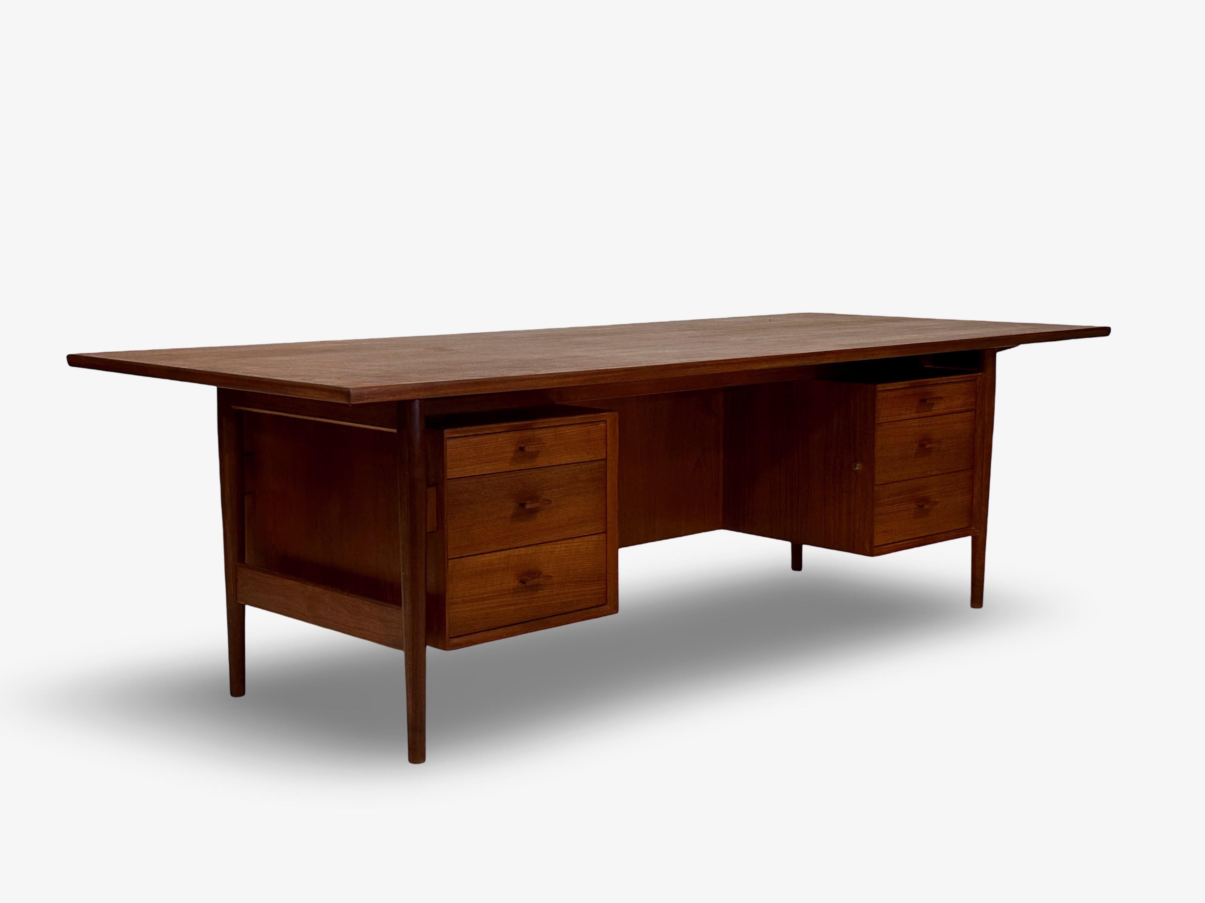 Rare and huge teak desk designed by Arne Vodder and manufactured by Sibast Furniture, Fyn, Denmark.
Designed and produced in the 1950s.