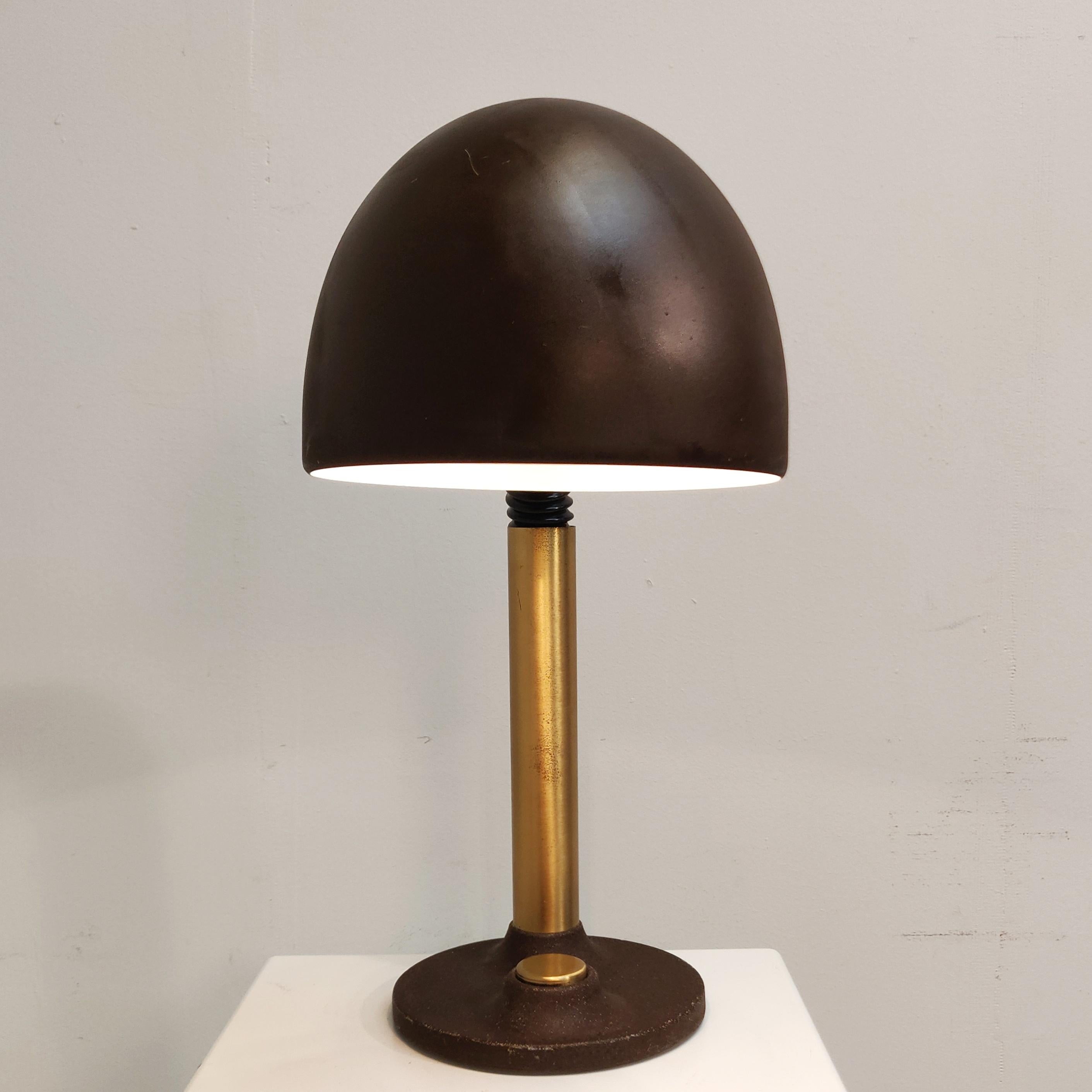 This large mid-century model 7404 table or desk lamp with brass details and a brown shade with a cast iron brown base. The lamp was produced and labelled by Hillebrand and remains in an original condition.

AA#240144