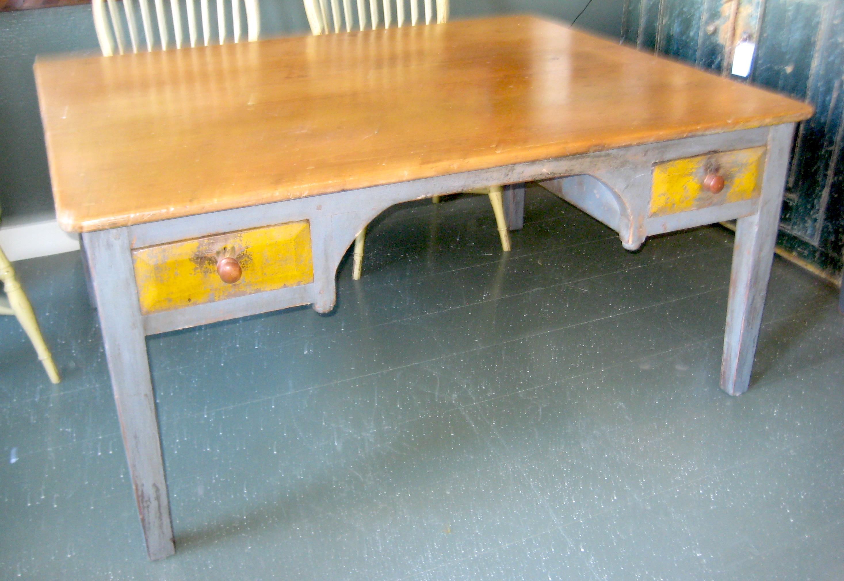 19th century desk table. Unpainted planked wood top, base in Original Grey Paint with Ocher painted drawers and Red painted knob pulls on one side. Other side with later kneehole cutout converting to partner's desk.