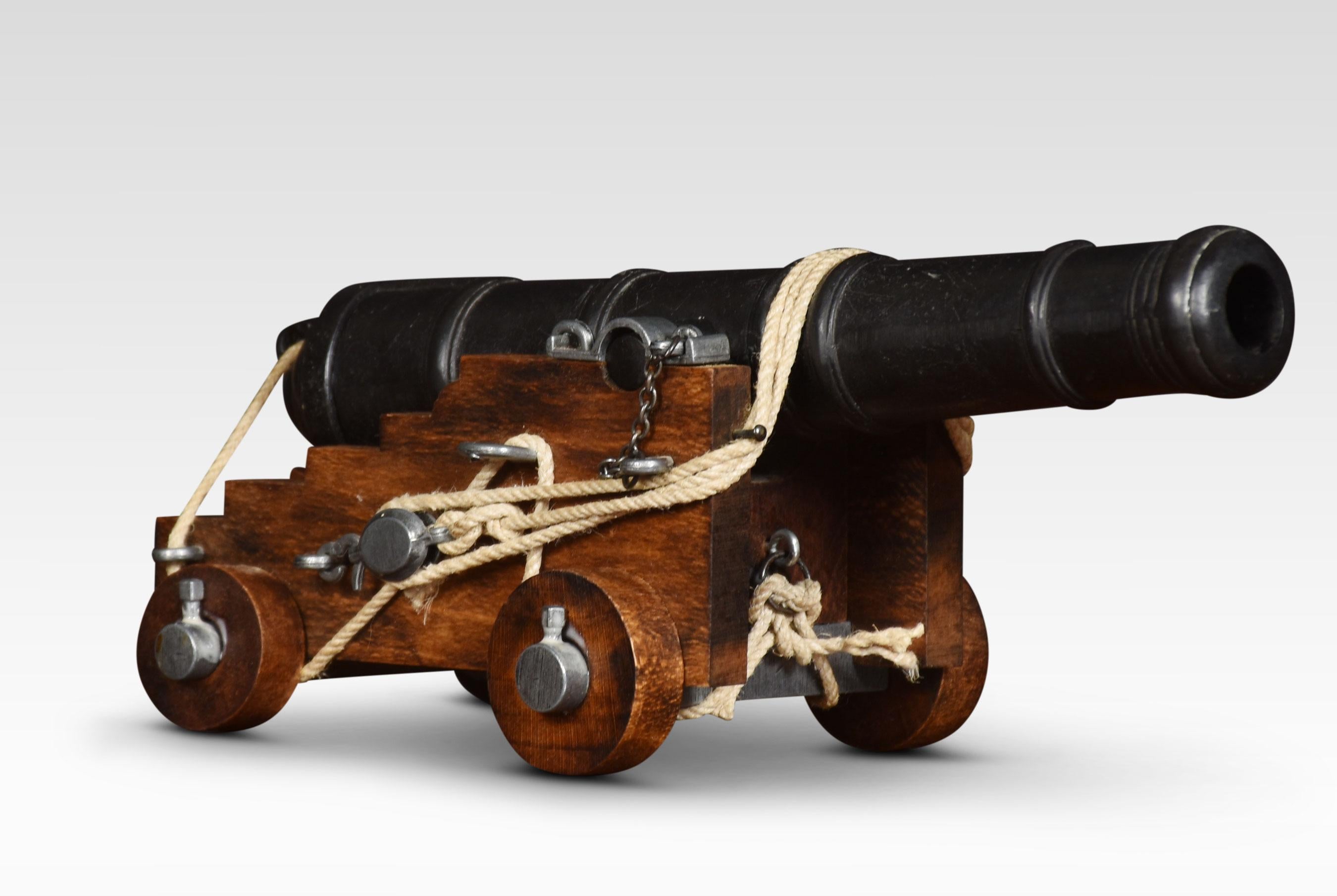 Desktop model of a cannon having cast-iron barrel on later oak carriage with working wheels.
Dimensions
Height 5 inches
Width 5 inches
Depth 10.5 inches.