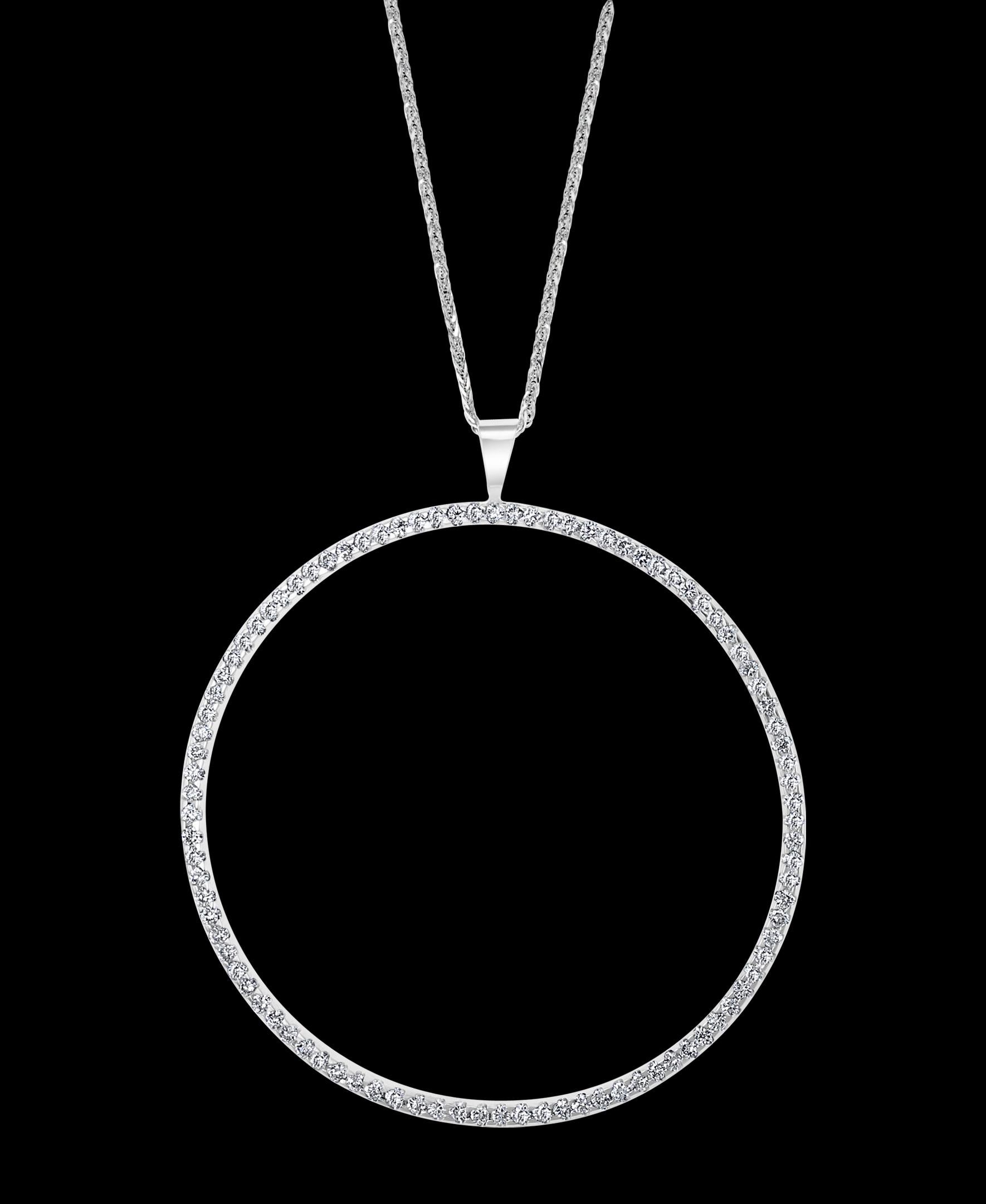 Large Diamond Circle Pendant/ Necklace 18 K White Gold With 14 K Gold Chain
Diamond Weight  approximately 2.5 to 3.0 Carats
Diamonds are eye clean, Fine  quality with lots of shine
18 K gold Weight  6 Grams
Very affordable price for this particular