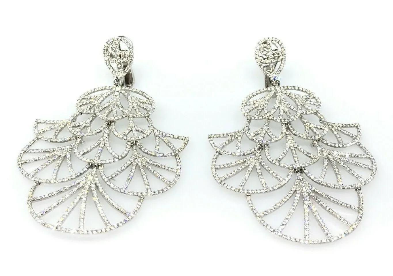 Large Diamond Fan Earrings with 9.50 Carats Total Weight in 18k White Gold

Large Diamond Fan Style Cut-out Earrings feature 9.50 carats of Round Brilliant Diamonds set in a slightly flexible framework of 18k White Gold. The earrings are secured by