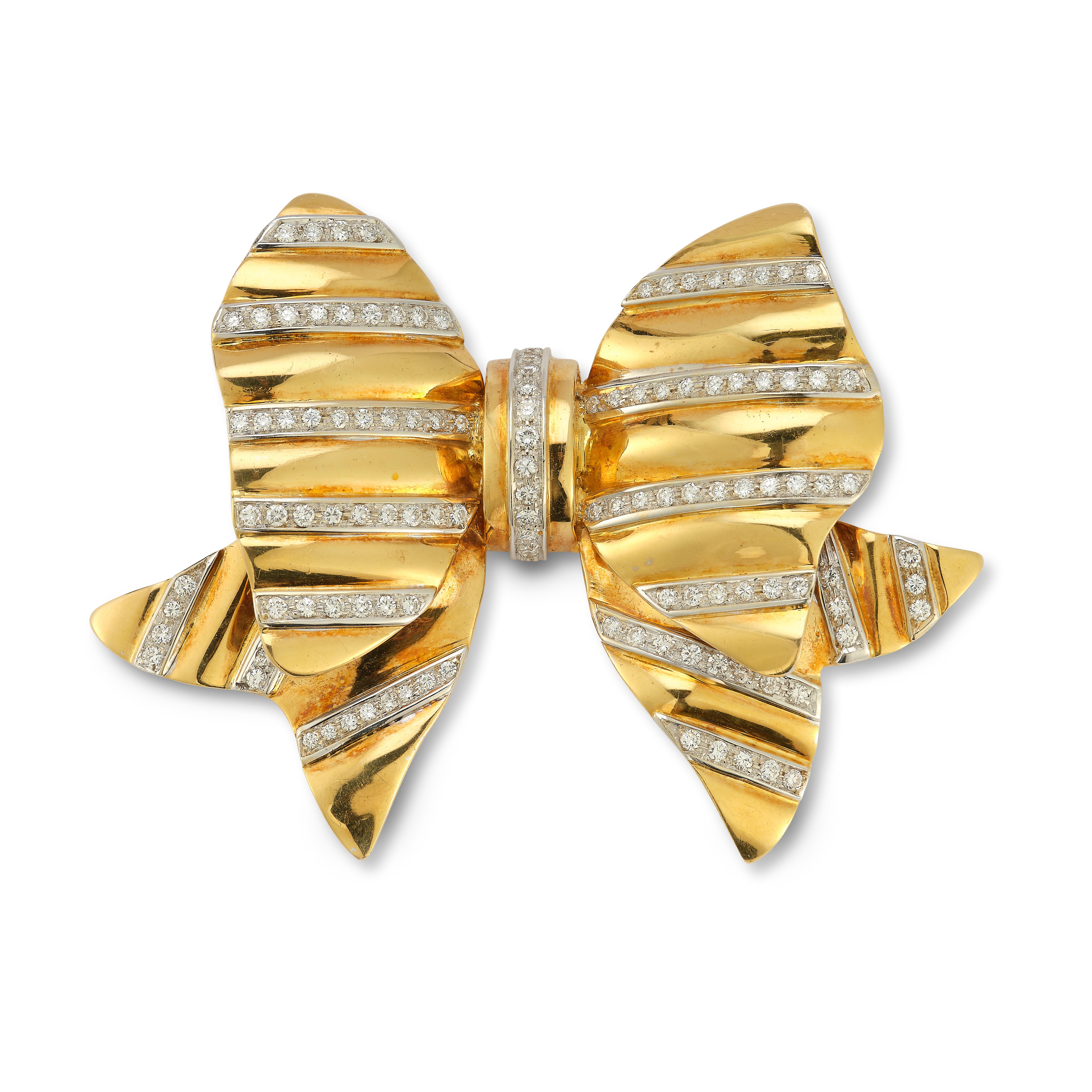 Large Diamond & Gold Bow Brooch,

Round cut diamonds set in 14k yellow gold 

Measurements: 3.5