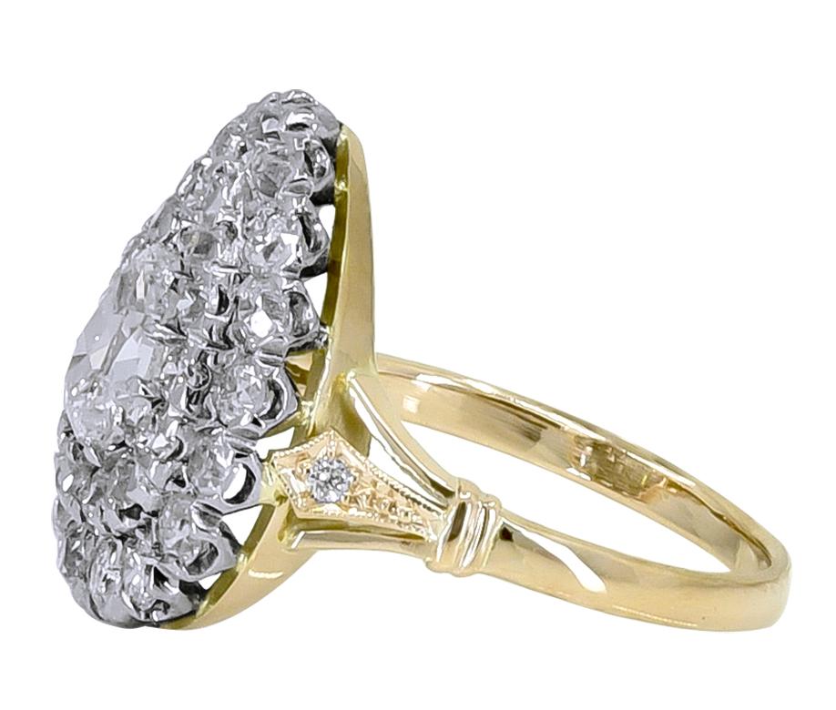Sparkling diamond ring.  The center is a pear-shaped .70 ct. diamond. Surrounded by two rows of brilliant cut diamonds, approximately 2.30 cts.   All original, meticulously made by hand.  Set in 18K yellow gold and platinum.  Size 7 and can be