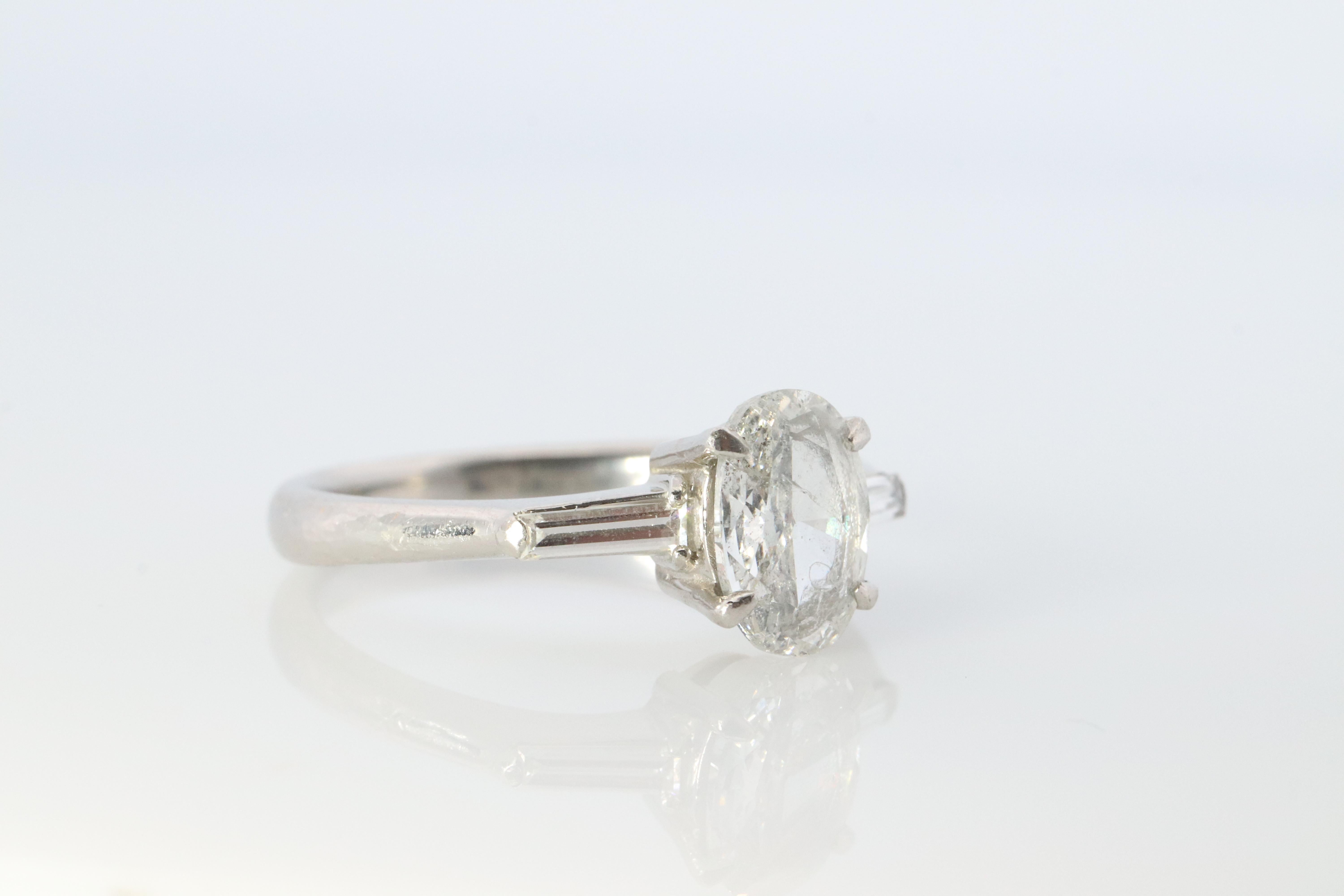 Modern LARGE Diamond Oval engagement ring. Platinum 1CT Oval Diamond Solitaire baguette For Sale