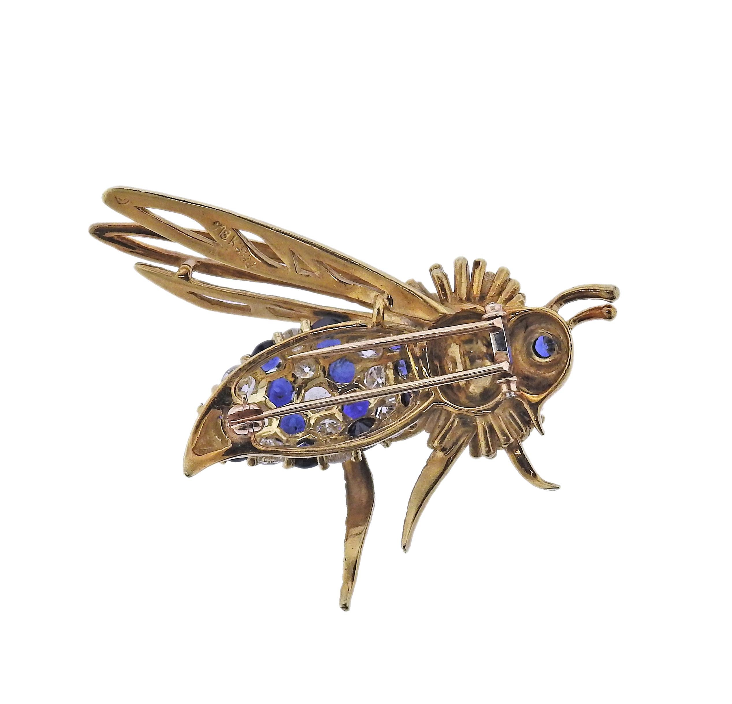 Adorable 18k gold wasp bee insect brooch, decorated with blue sapphires and approx. 2 carats in VS2-SI1/H diamonds. Brooch is 44mm x 45mm. weight - 18.7 grams. Marked: J mark, 18k, 3582. 