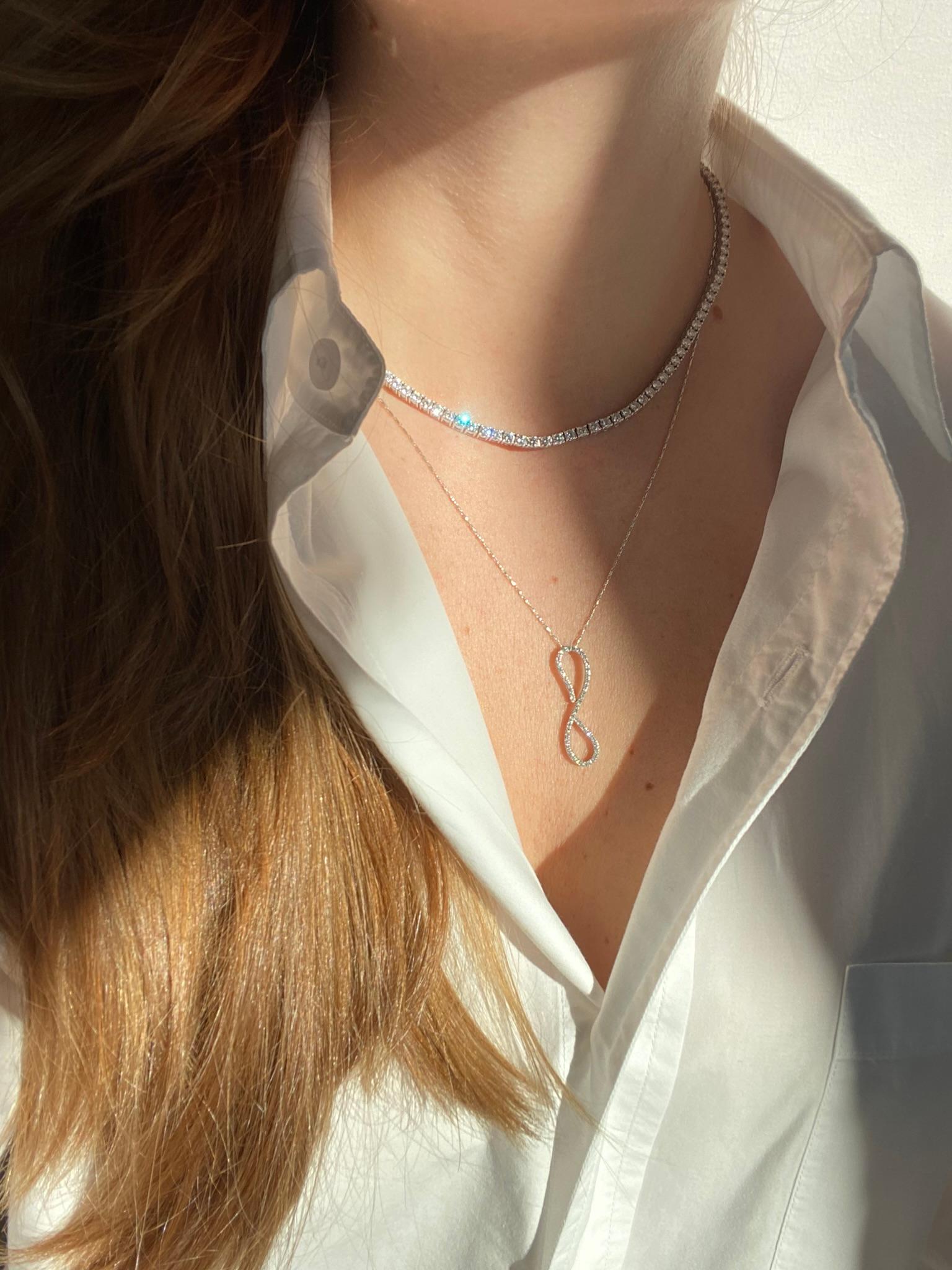 Our signature TAYLOR Necklace offers a stunning combination of versatility and elegance. Wear it alone or attach a custom pendant for a look that can take you from day to night. 

The best feature is that you may customize multiple pendants for use