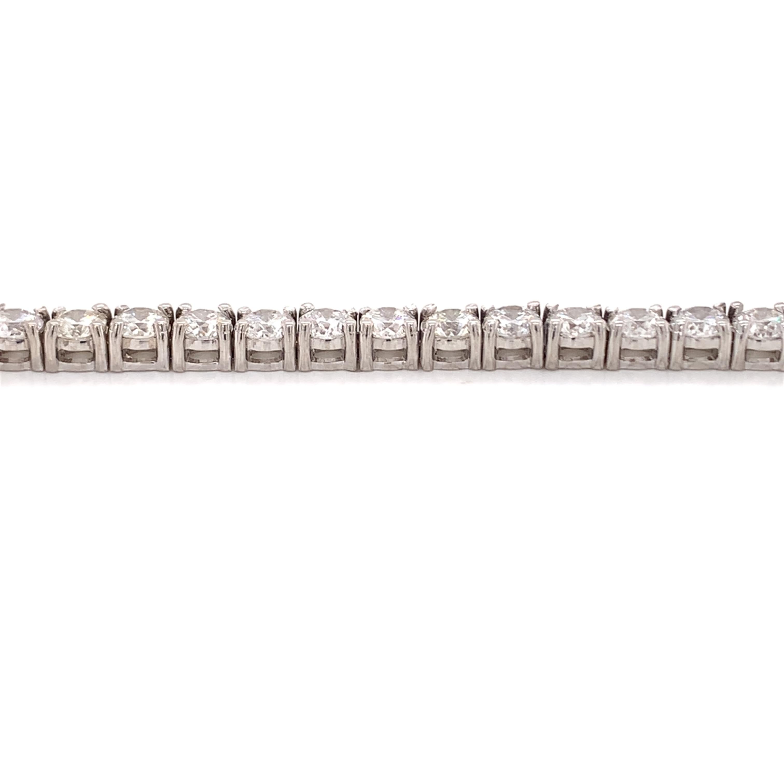 Diamond tennis bracelet made with real/natural brilliant cut diamonds. Total Diamond Weight: 9.83 carats. Diamond Quantity: 42 round diamonds. Color: G-H Clarity: SI2 Mounted on 14 karat white gold.