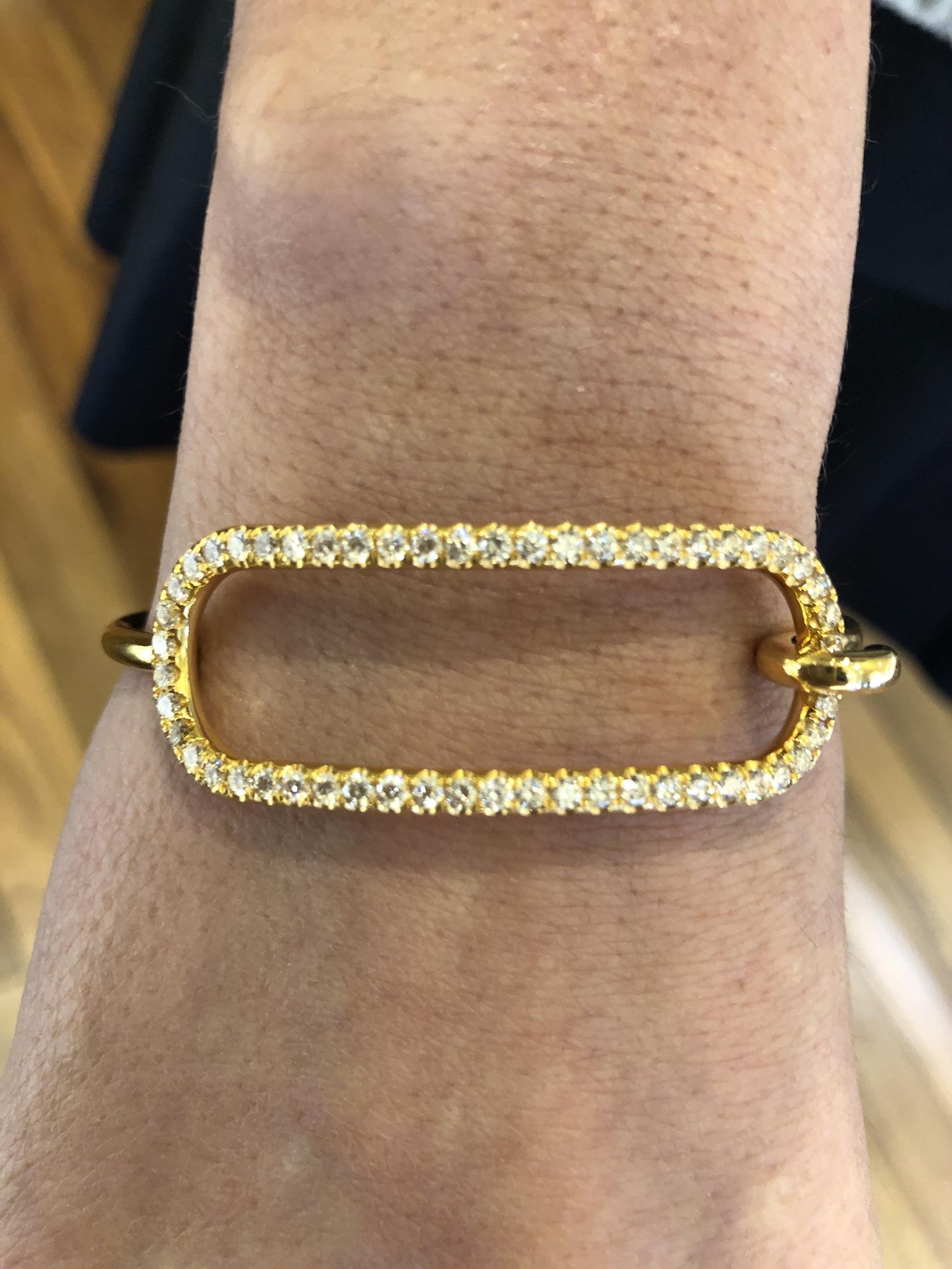 Andrew Glassford's signature 3mm Diamond Tension Bracelet in 18K yellow gold. 1.93 carats of round brilliant GH VSI Diamonds that creates a stunning effect on the wrist. The entire bracelet is 3mm around. The tension series is based off the 18k