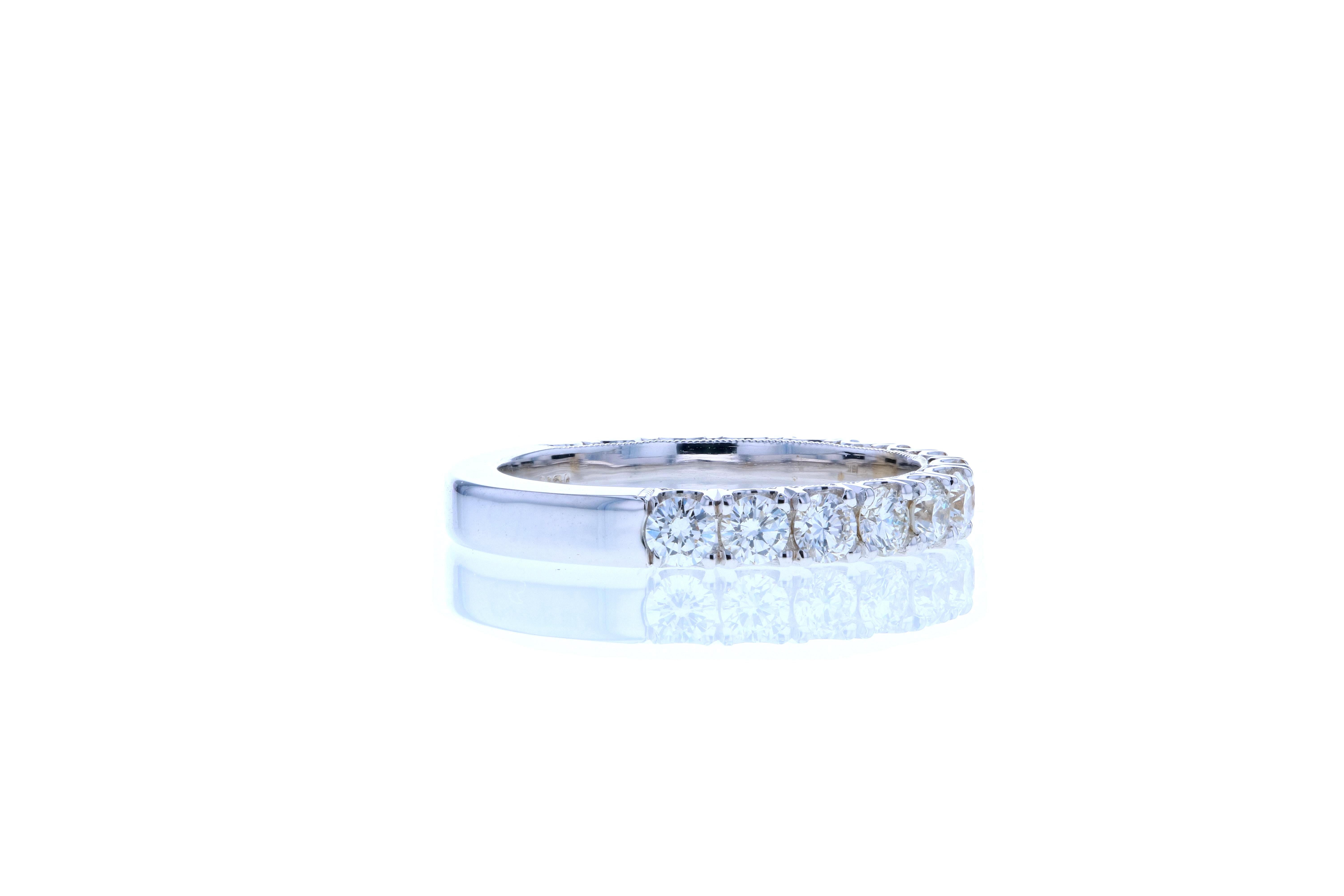 This classic diamond wedding band features larger than normal size diamonds to elevate the look. It features 15 round brilliant cut diamonds and is set in 18K white gold. This style of wedding band can be made in any color metal and with larger or