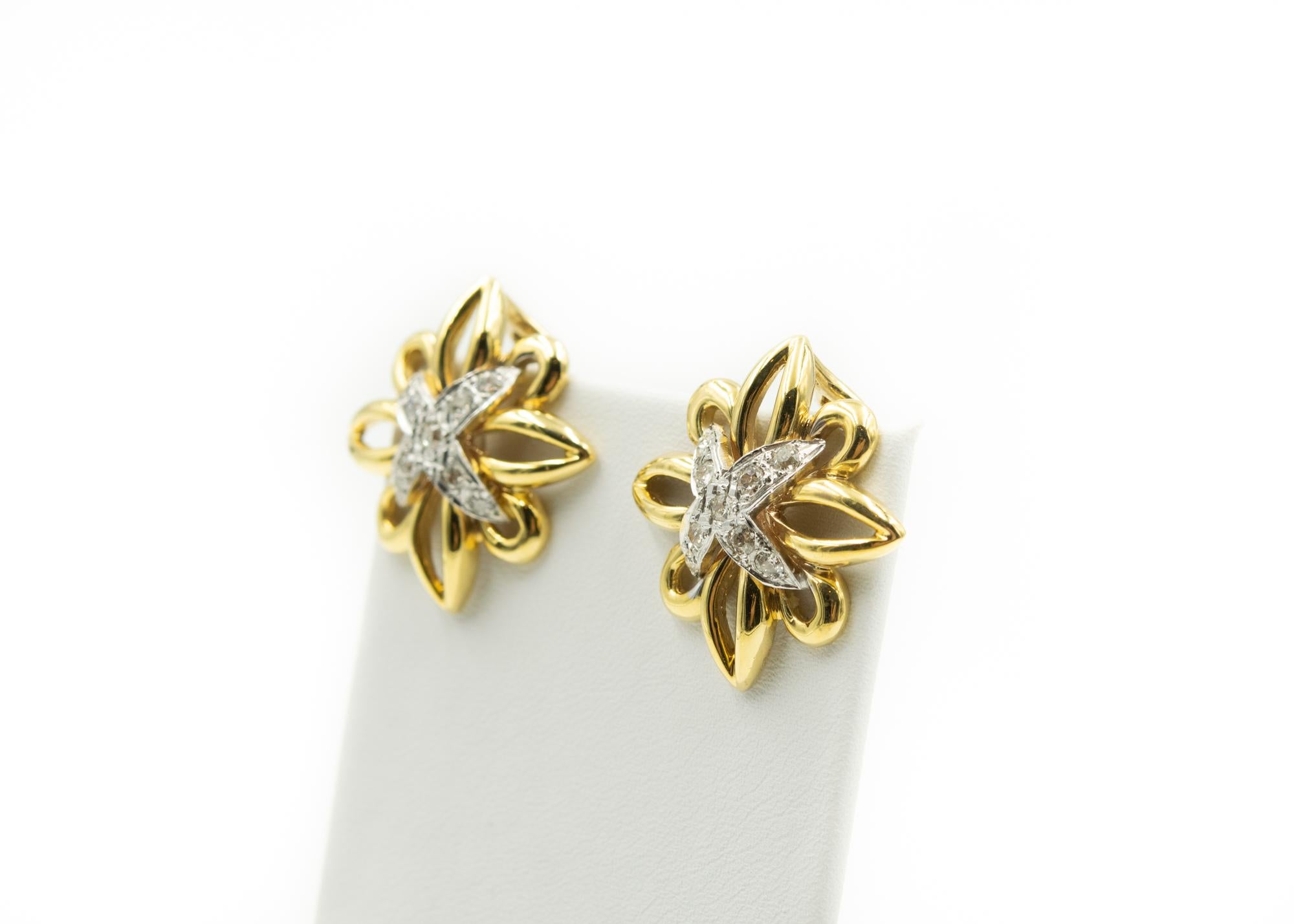 Stunning Large Paloma Picasso style open design flower earrings featuring a diamond 