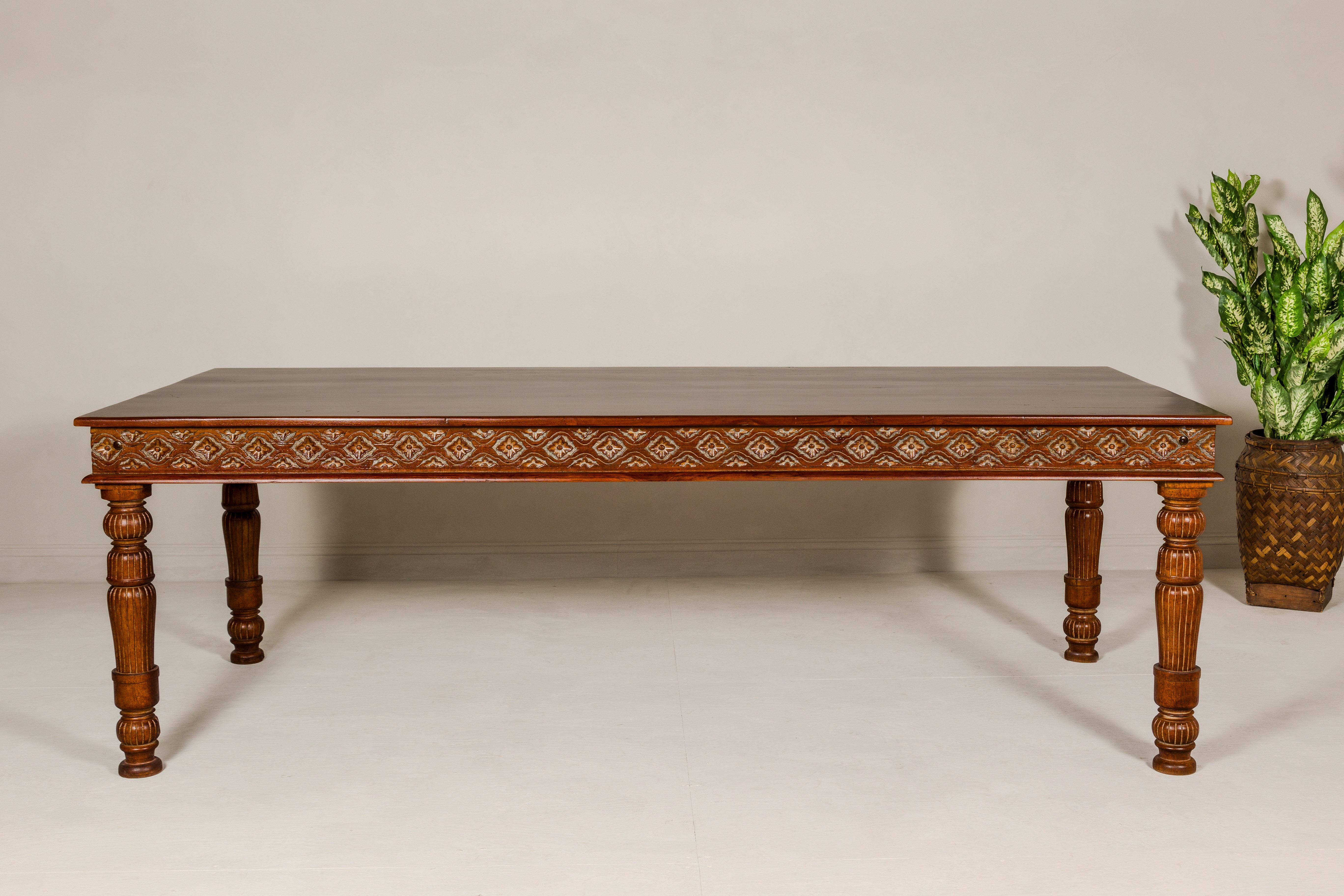 Indian Large Dining Room Table with Carved Apron, Floral Motifs and Turned Legs For Sale