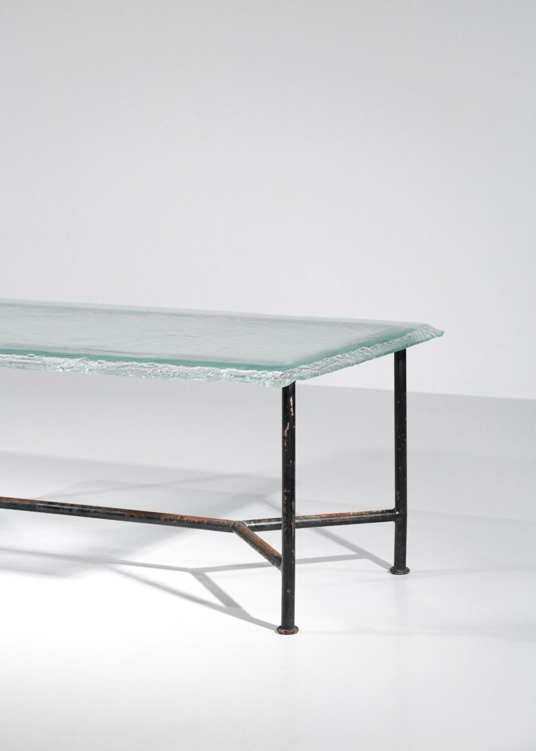 Large French dining table made of a glass slab and a black lacquered metal base (original paint). The base is from the 1970s and the glass slab from the 1980s/1990s. Very nice vintage condition, note the traces of oxidation on the metal (see photos).