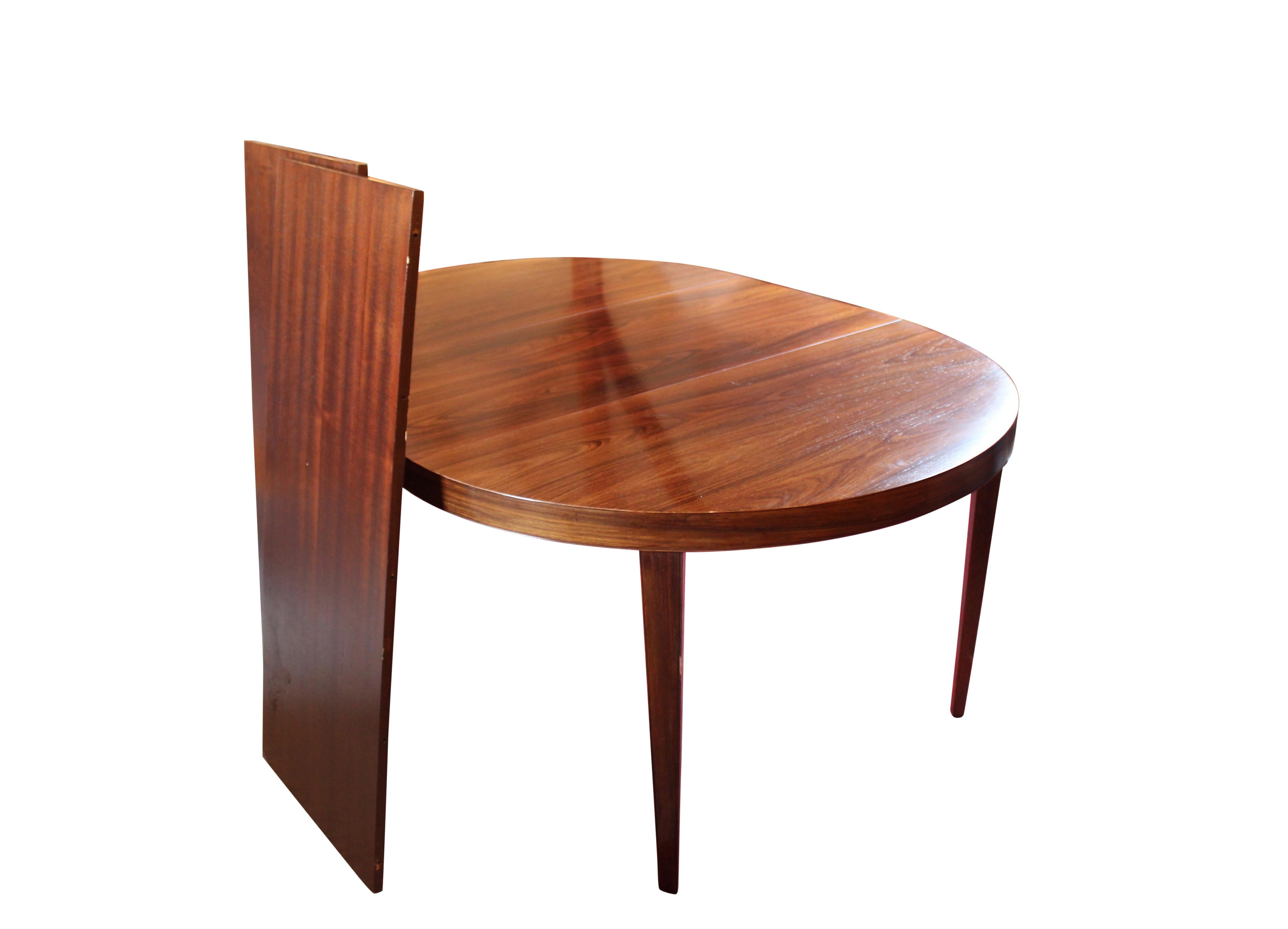 Large dining table with 3 extension leaves of rosewood designed by Severin Hansen for Haslev furniture factory in the 1960s. The table is in great vintage condition.