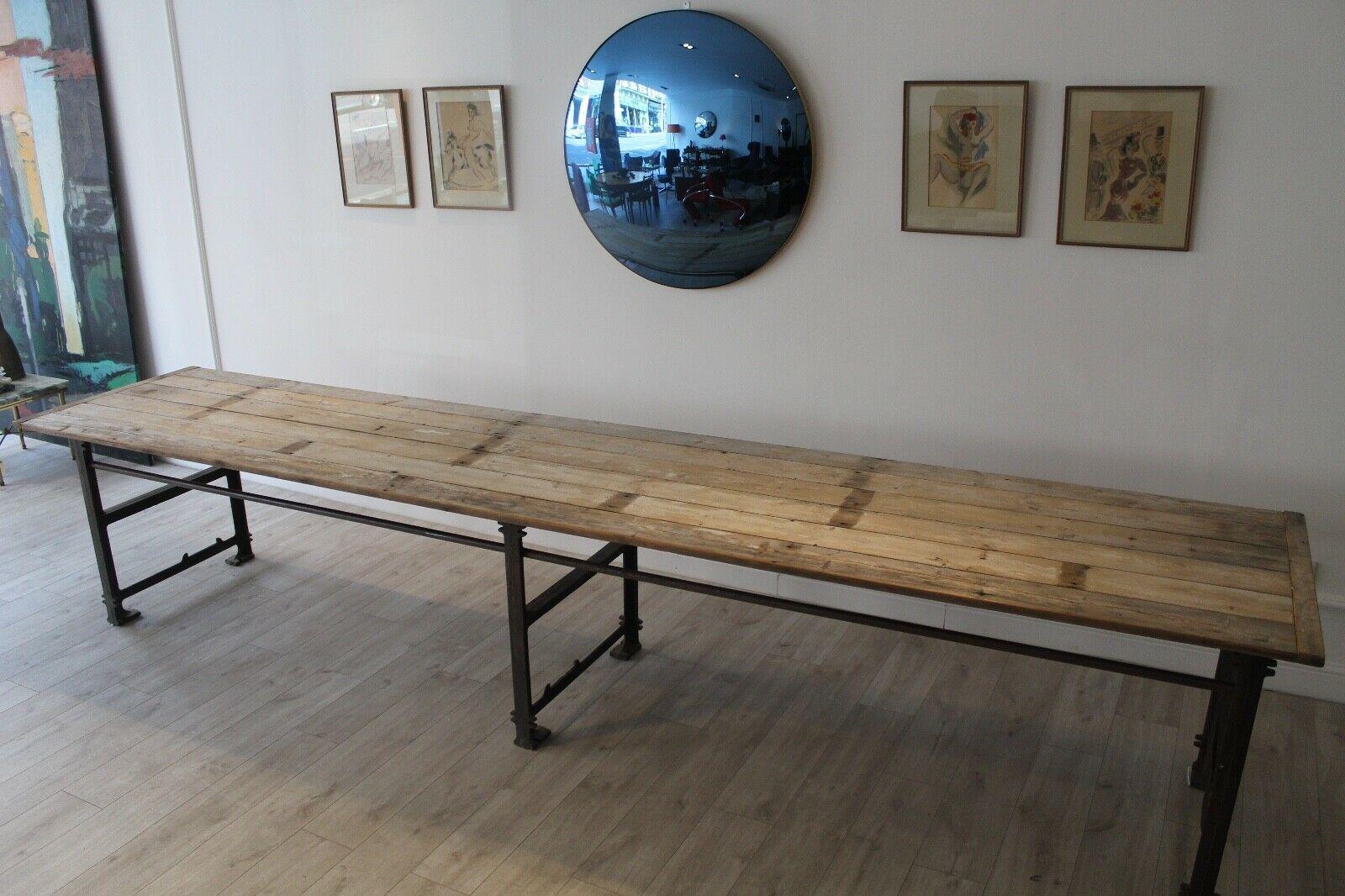 This is a rare, one off handmade extra long dining table.

The tabletop has been made from reclaimed wood with a rustic and scrub top finish. The base is made from reclaimed steel which gives an Industrial and stylish style to the table.